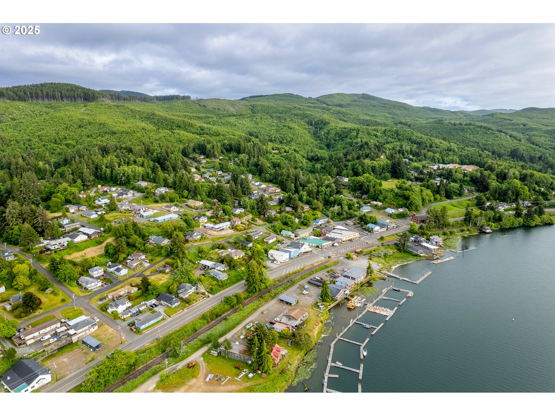336 Gregory Street Wheeler, OR 97147 - Photo 41 of 42 a view of a lake with a city