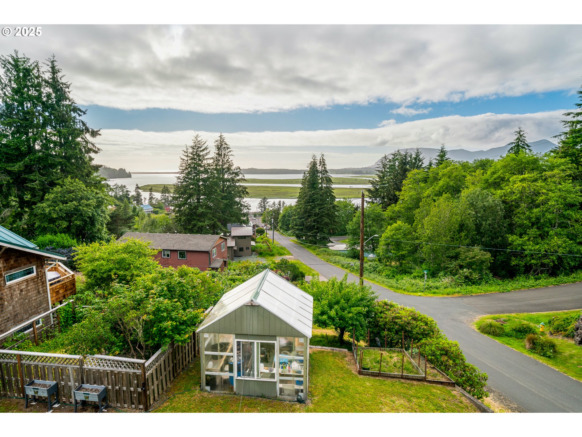 336 Gregory Street Wheeler, OR 97147 - Photo 5 of 42 a view of a house with a yard and potted plants