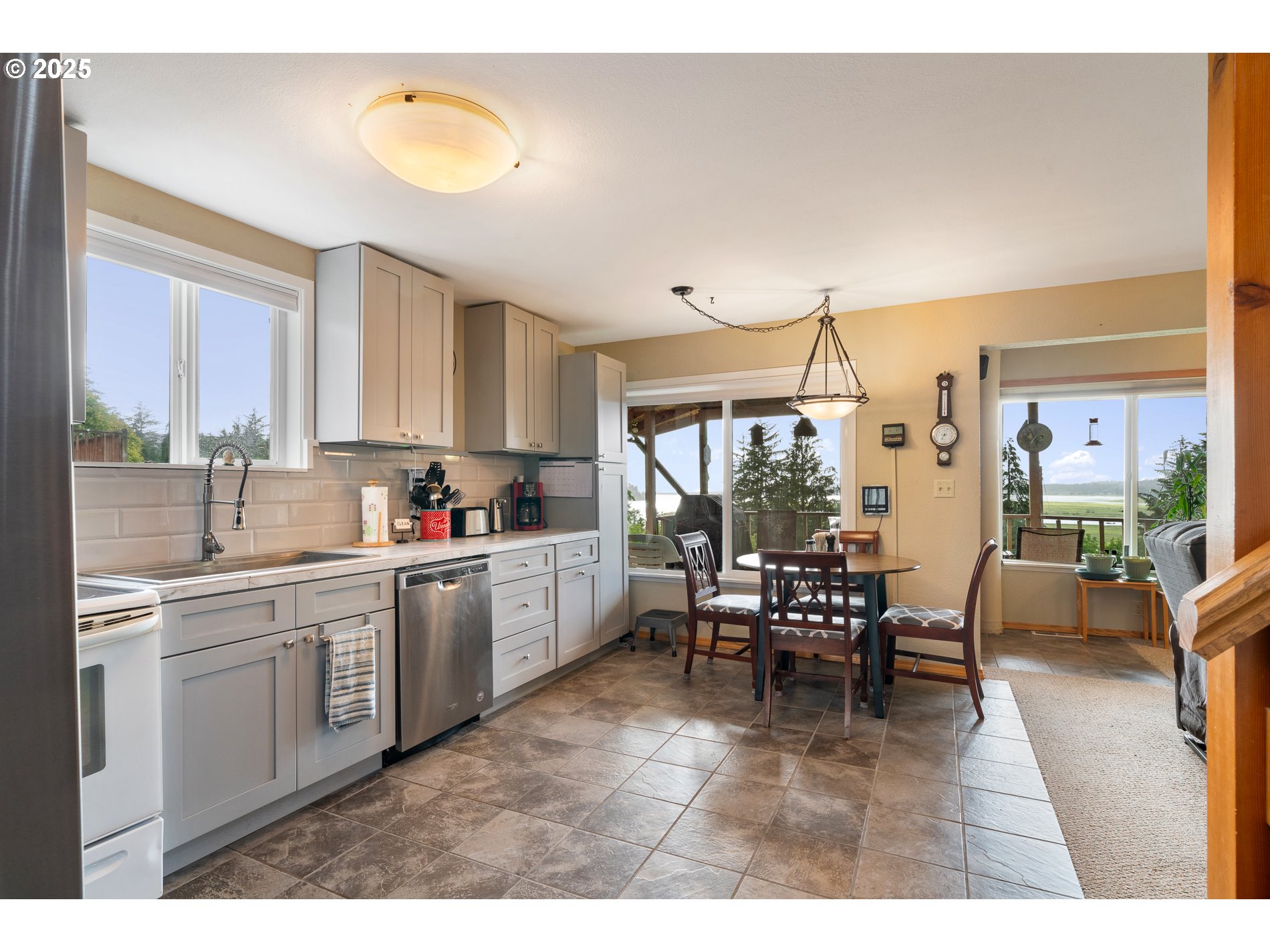 336 Gregory Street Wheeler, OR 97147 - Photo 9 of 42 a kitchen with appliances cabinets table and chairs