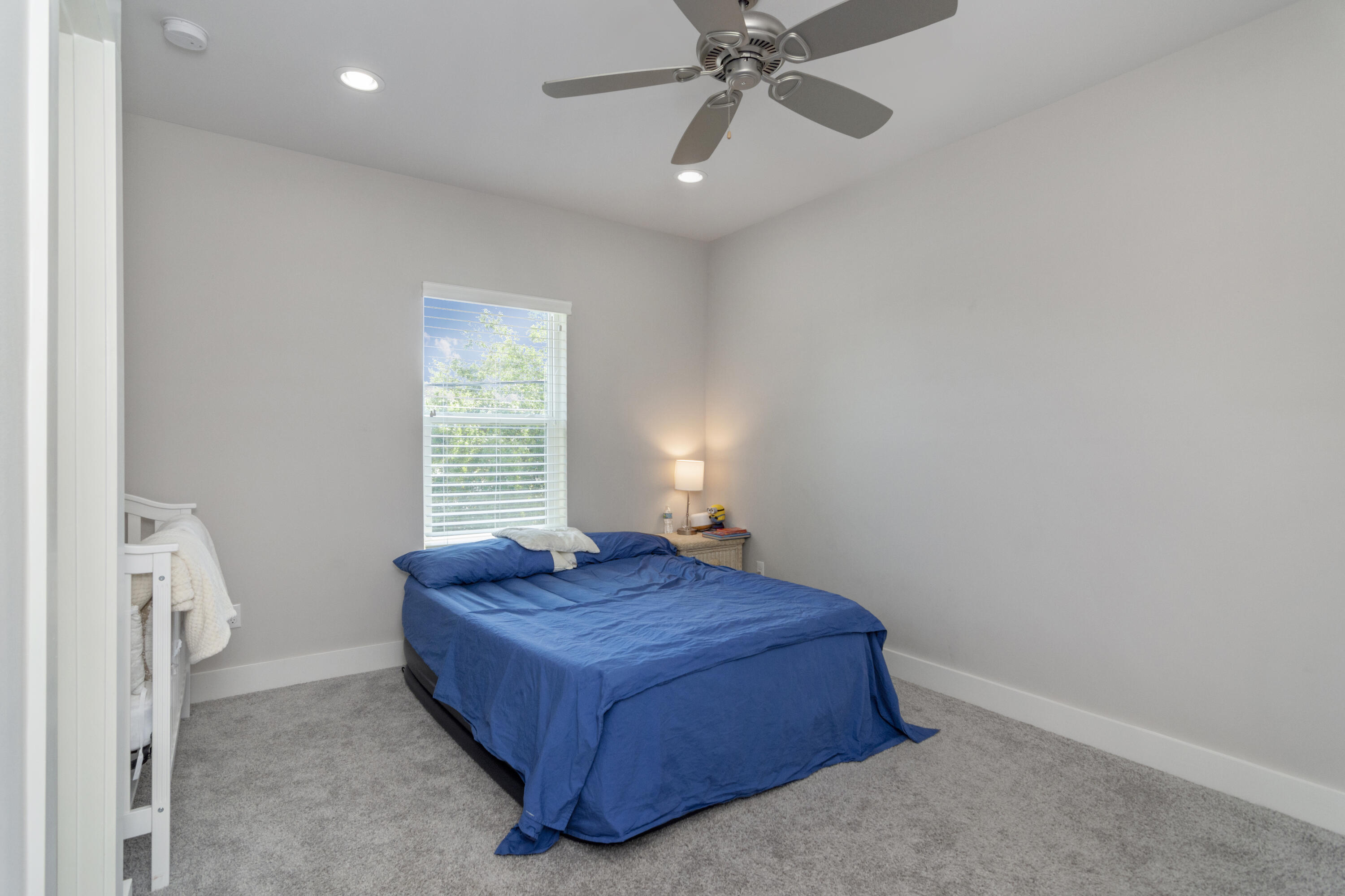 995 Airport Road, Unit 2 Destin, FL 32541 - Photo 22 of 39 a bedroom with a bed and a window