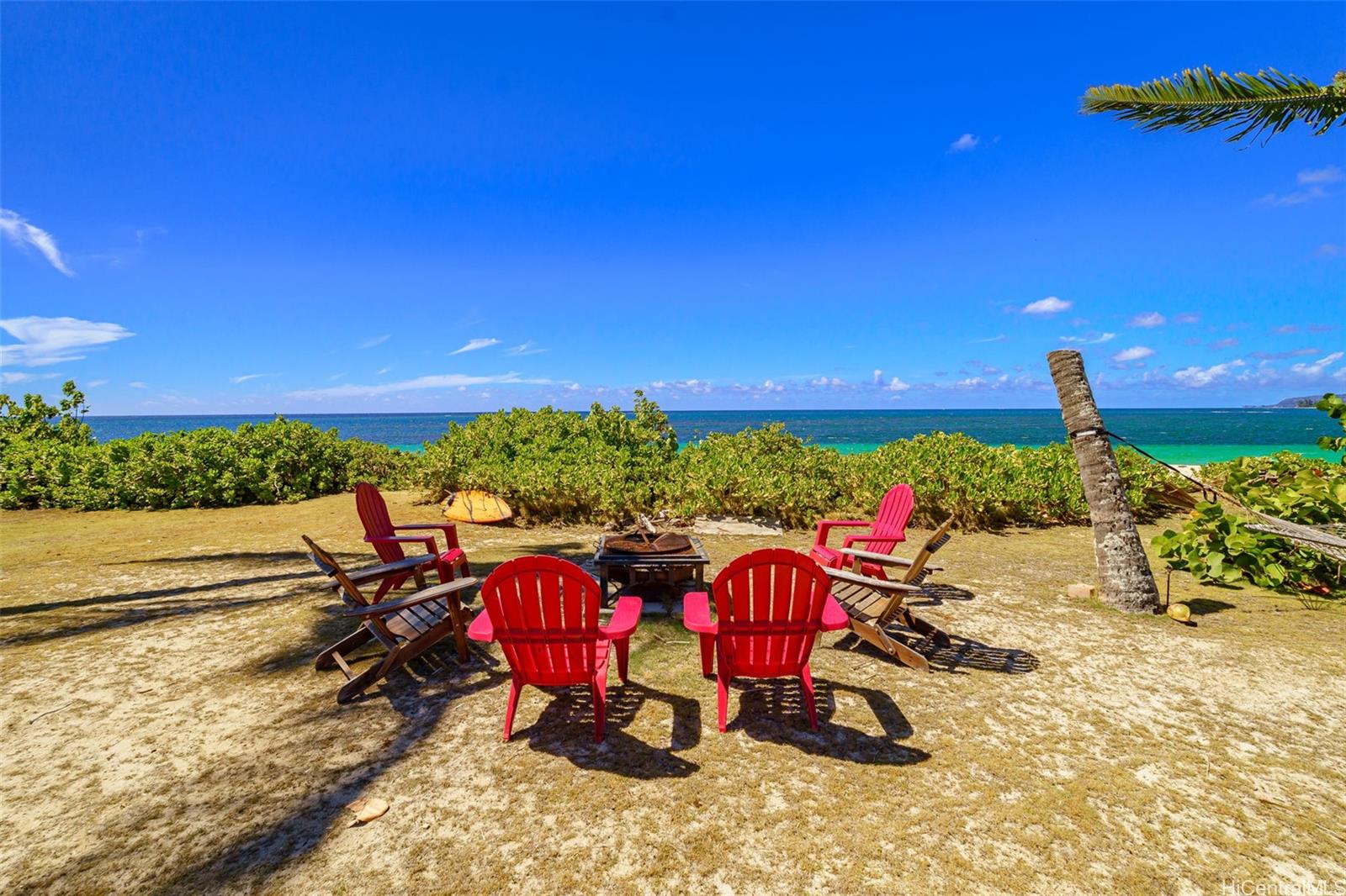 67-267 Kahaone Loop, Unit 2 Waialua, HI 96791 - Photo 12 of 20 a view of a porch with furniture and a yard