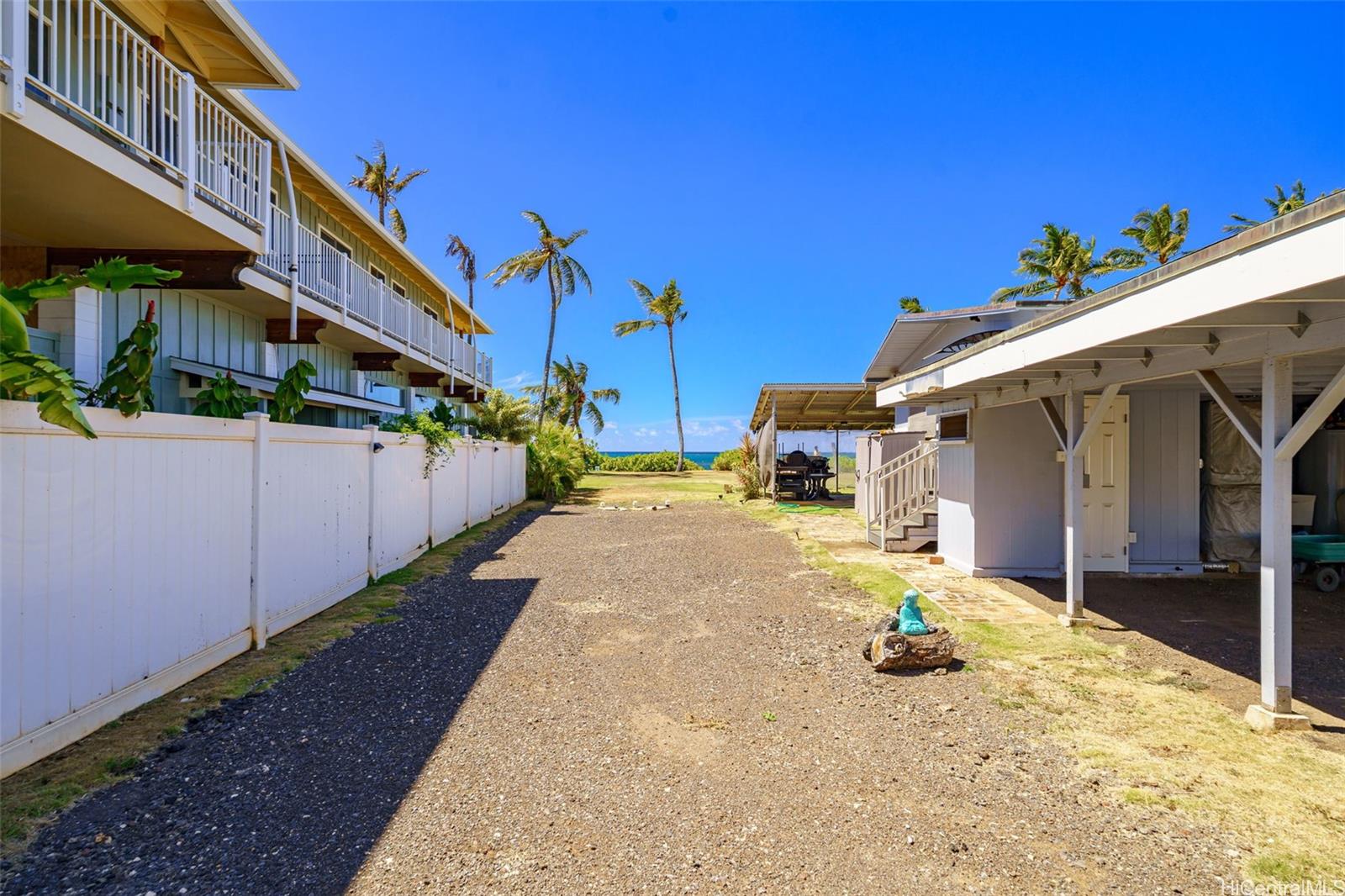 67-267 Kahaone Loop, Unit 2 Waialua, HI 96791 - Photo 18 of 20 a view of a house with a yard