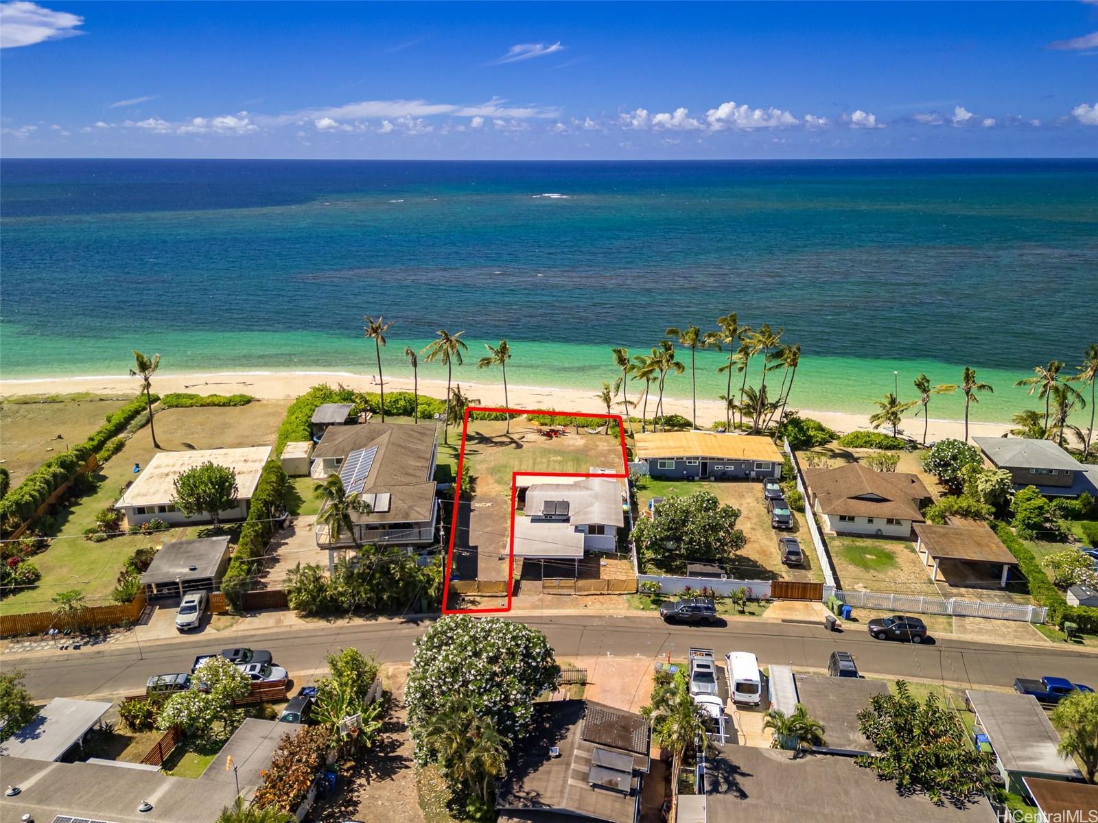67-267 Kahaone Loop, Unit 2 Waialua, HI 96791 - Photo 2 of 20 a view of a swimming pool with an outdoor space and seating area
