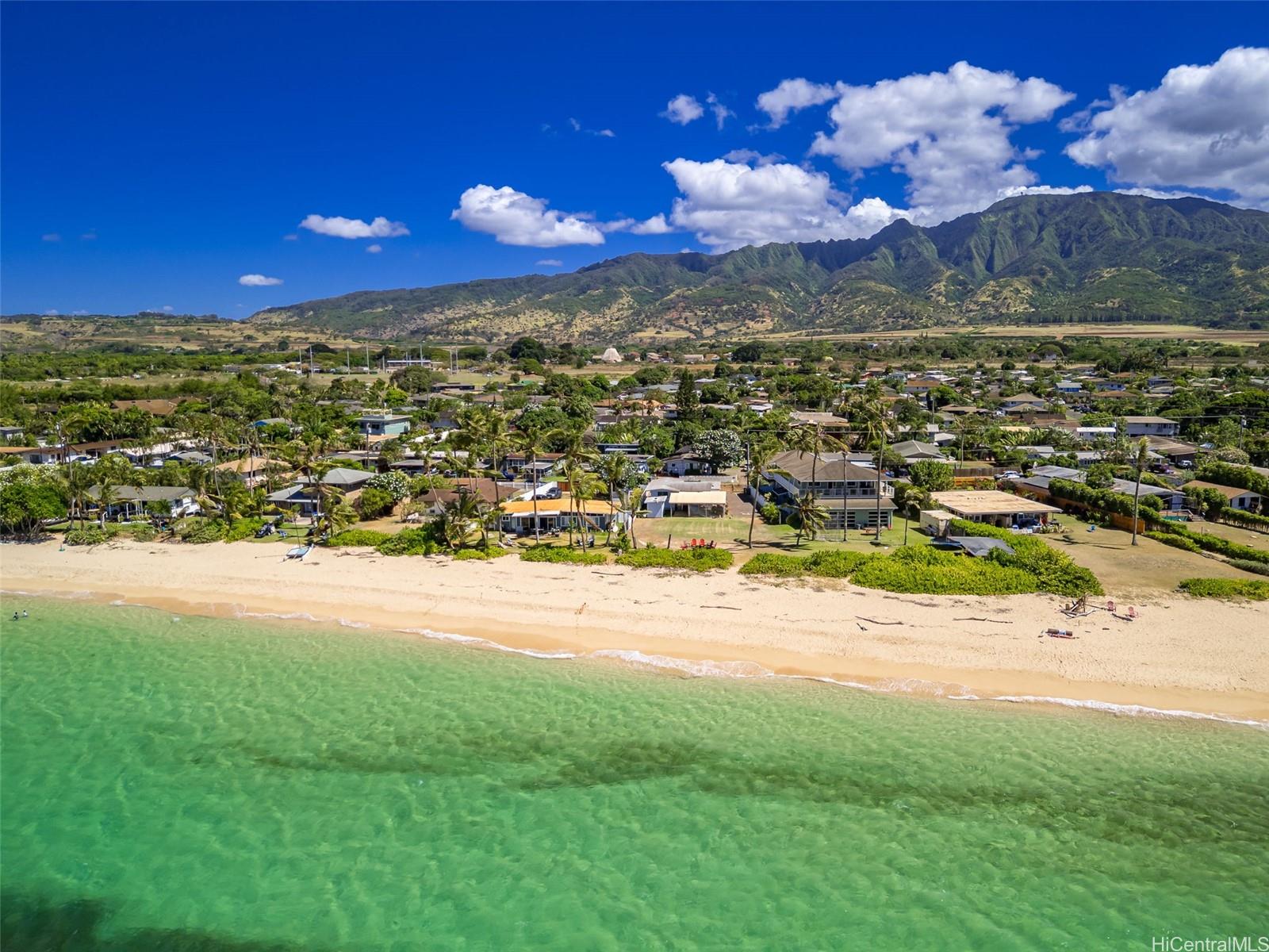 67-267 Kahaone Loop, Unit 2 Waialua, HI 96791 - Photo 8 of 20 a view of a lake with a houses