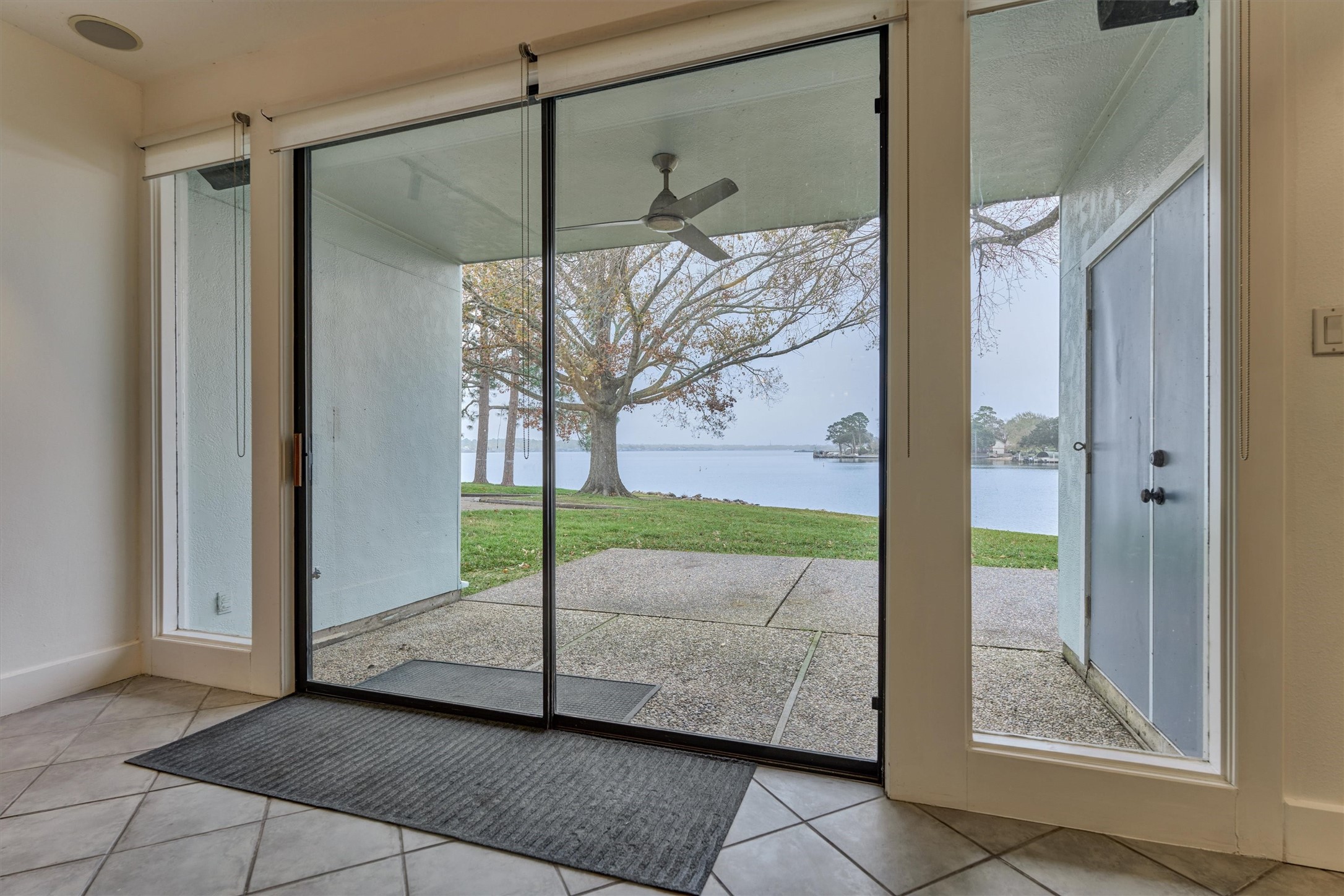 1427 Bowsprit Point Willis, TX 77318 - Photo 16 of 47 A closer look shows the covered porch and extended patio on the first floor. Double doors lead to a spacious storage closet.
