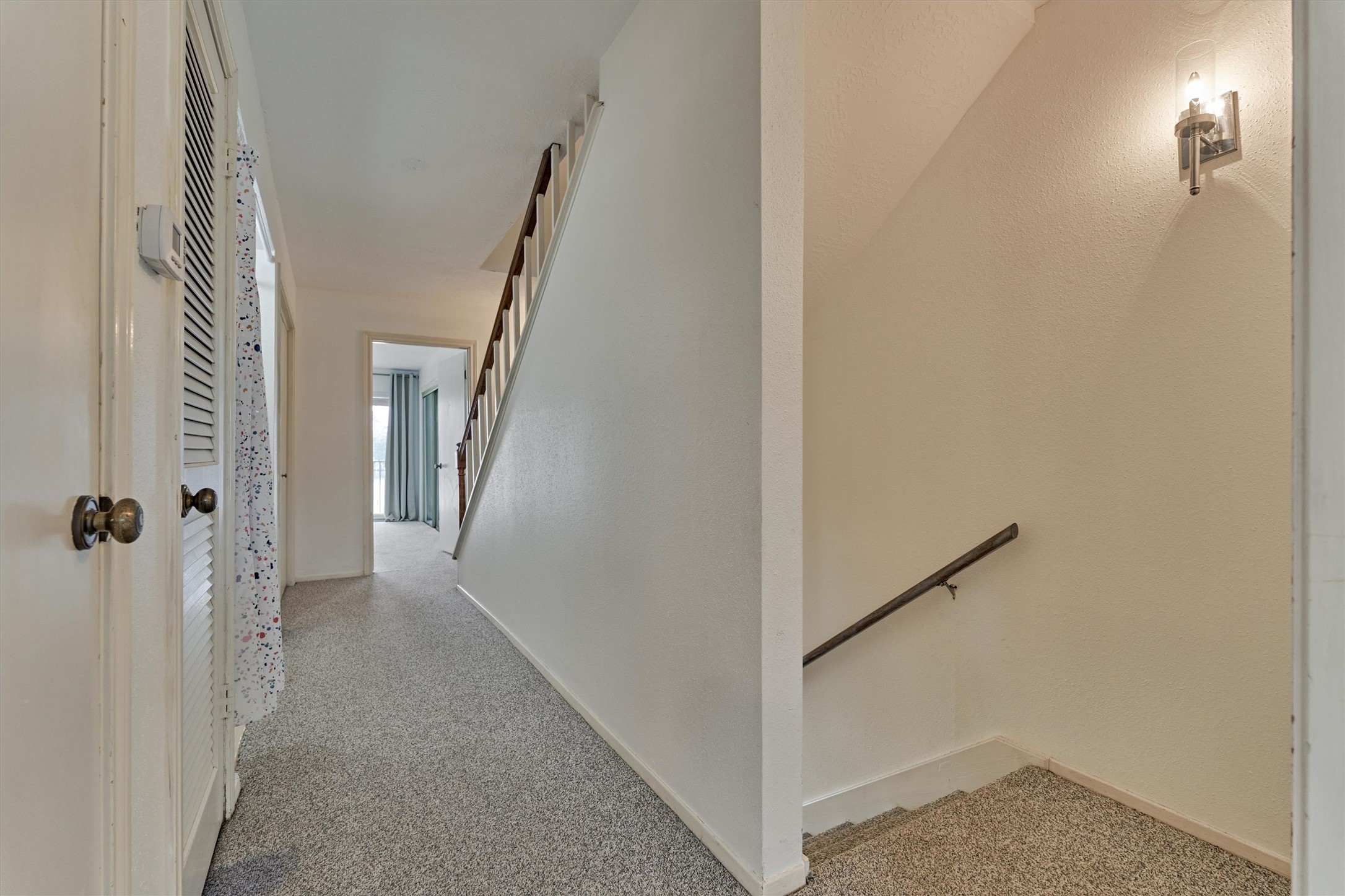 1427 Bowsprit Point Willis, TX 77318 - Photo 20 of 47 On the second floor are two bedrooms, each with their own ensuite bath, a laundry area and several storage closets along the hallway.