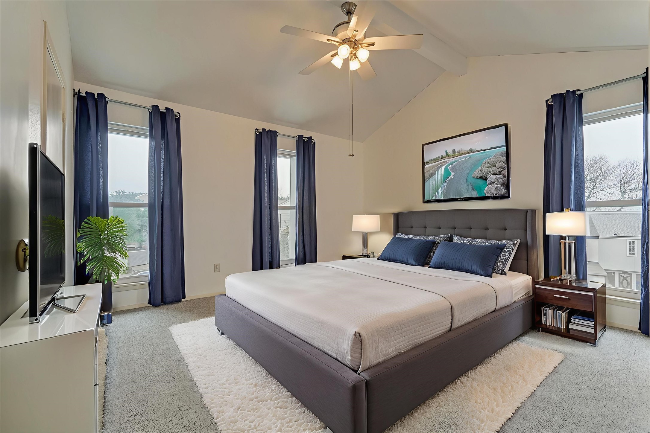 1427 Bowsprit Point Willis, TX 77318 - Photo 29 of 47 Guest bedroom #3 is on the third floor and features large windows overlooking the front and side of the home. A vaulted ceiling adds to the open feel of this room. Virtually staged.