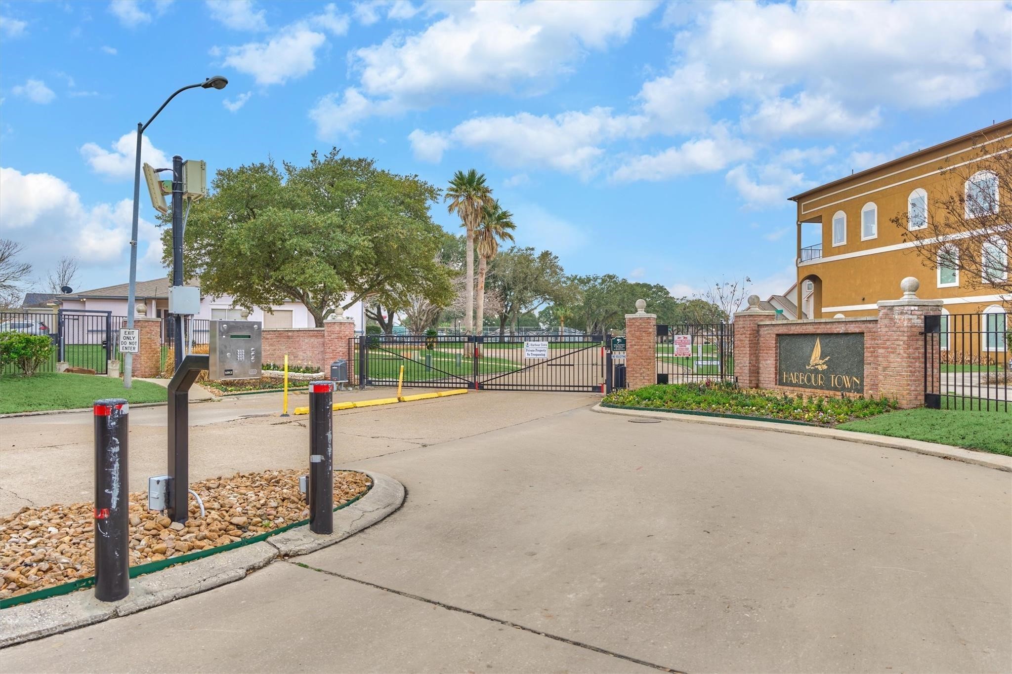 1427 Bowsprit Point Willis, TX 77318 - Photo 42 of 47 The gated entry to Harbour Town gives an extra level of privacy and security.