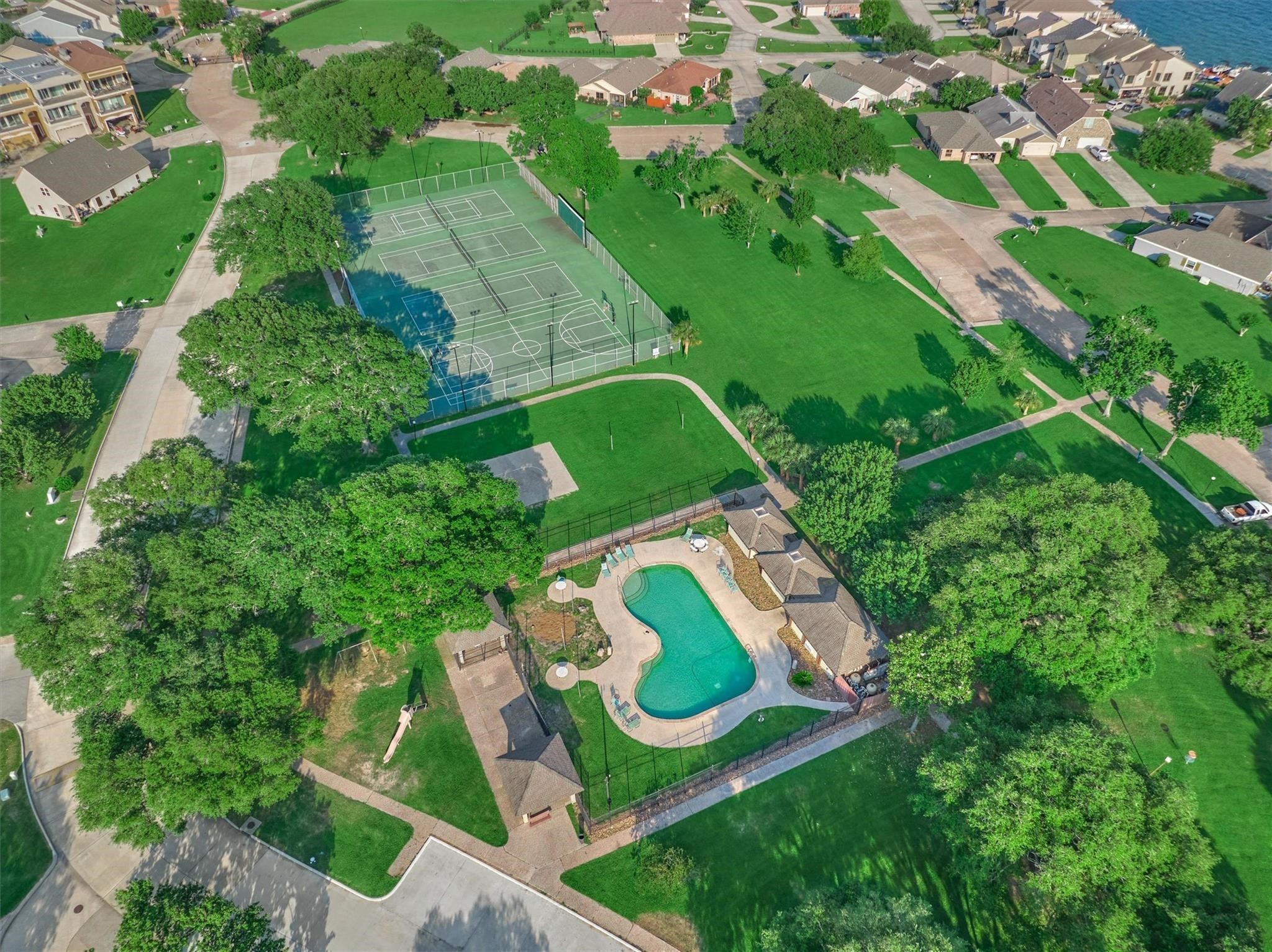 1427 Bowsprit Point Willis, TX 77318 - Photo 46 of 47 Neighborhood tennis courts, pool and sports courts are located in the heart of the community for residents of Harbour Town to enjoy.