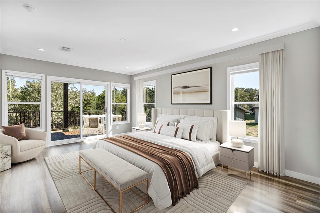 900 Chamberlin Road Dale, TX 78616 - Photo 10 of 14 a bedroom with a large bed and a large window