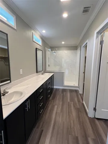 a bedroom with a large bed and a large window