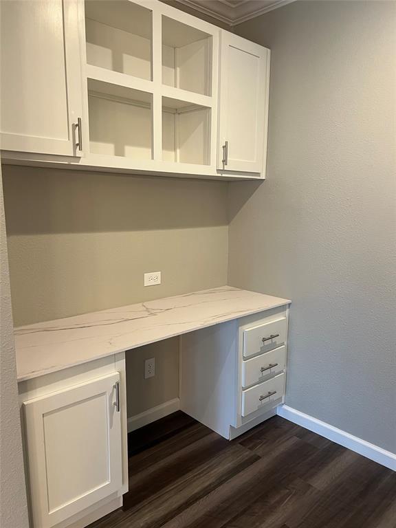 900 Chamberlin Road Dale, TX 78616 - Photo 5 of 14 a room with a white cabinets and wooden floor