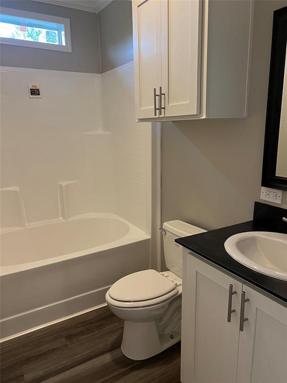 900 Chamberlin Road Dale, TX 78616 - Photo 8 of 14 a bathroom with a granite countertop toilet sink and bathtub