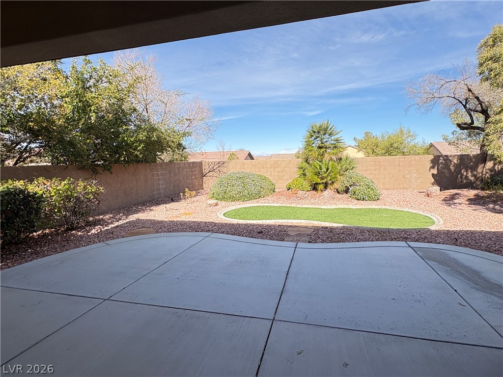 10 Caprington Road Henderson, NV 89052 - Photo 16 of 44 A low-maintenance yard provides a private oasis with a patterned concrete patio for outdoor enjoyment.