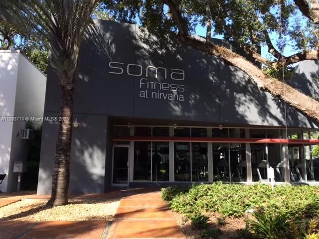 a house view with a sitting space and garden