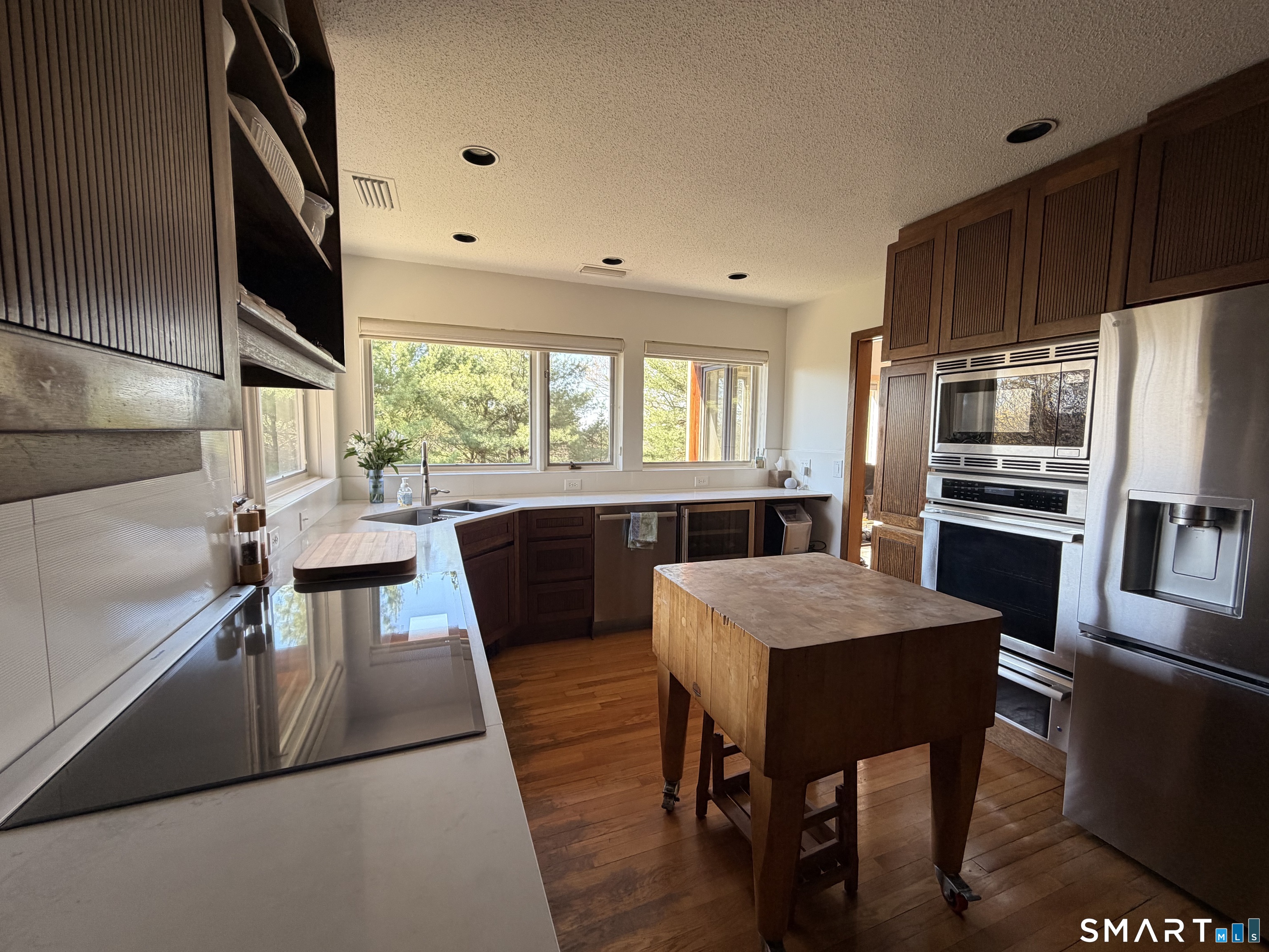 86 Washburn Road Canton, CT 06019 - Photo 7 of 40 a kitchen with a table chairs refrigerator and cabinets