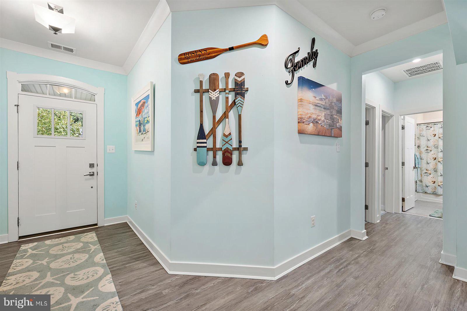 23546 Robalo Road Frankford, DE 19945 - Photo 16 of 78 a view of a hallway with wooden floor and closet