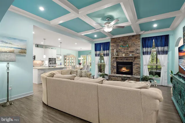 a kitchen with stainless steel appliances granite countertop a sink a stove and cabinets