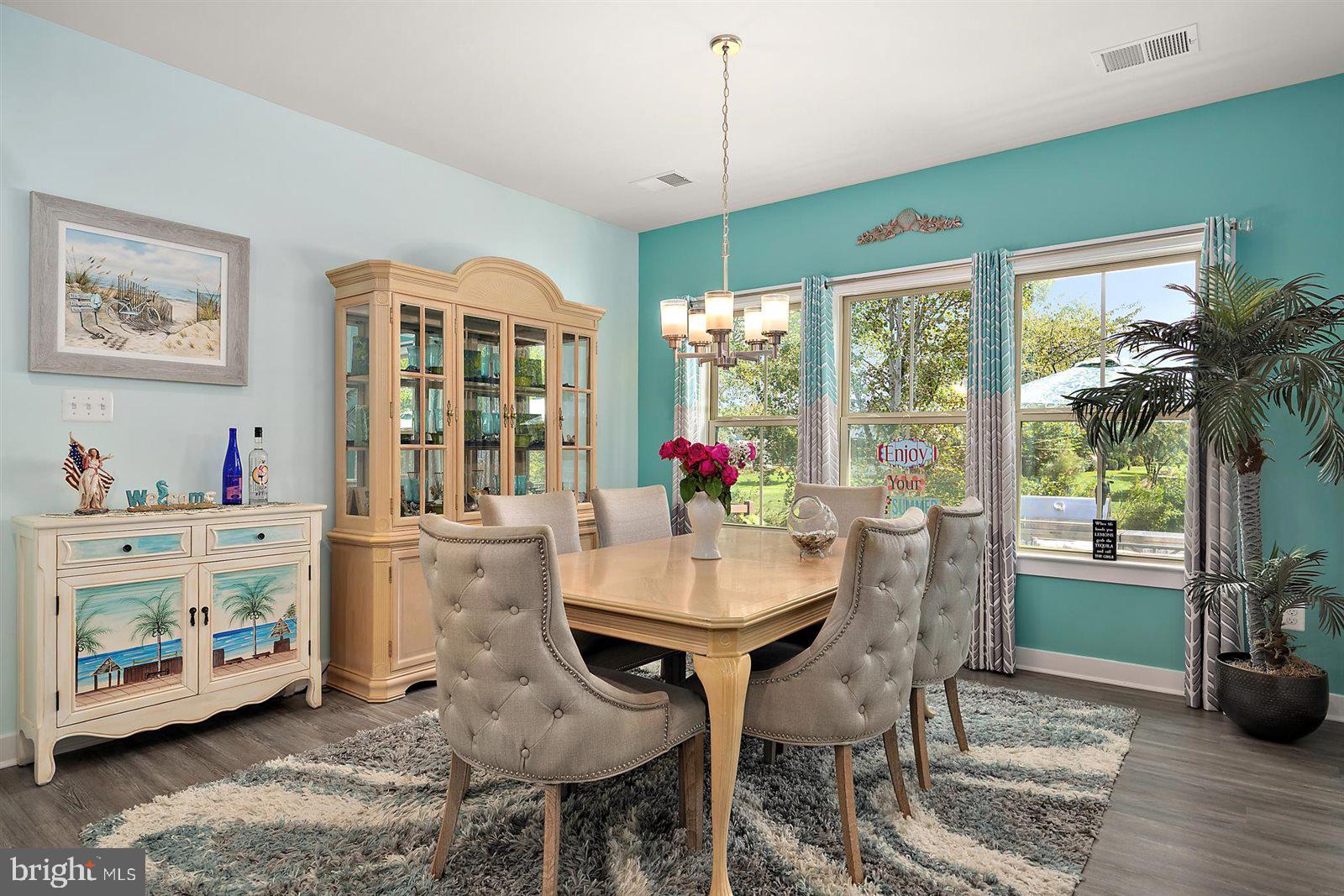 23546 Robalo Road Frankford, DE 19945 - Photo 34 of 78 a view of a dining room with furniture window and wooden floor