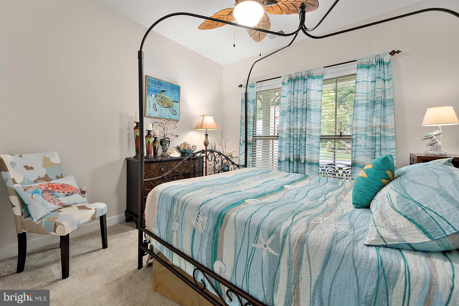 23546 Robalo Road Frankford, DE 19945 - Photo 42 of 78 a bedroom with a bed window and walk in closet