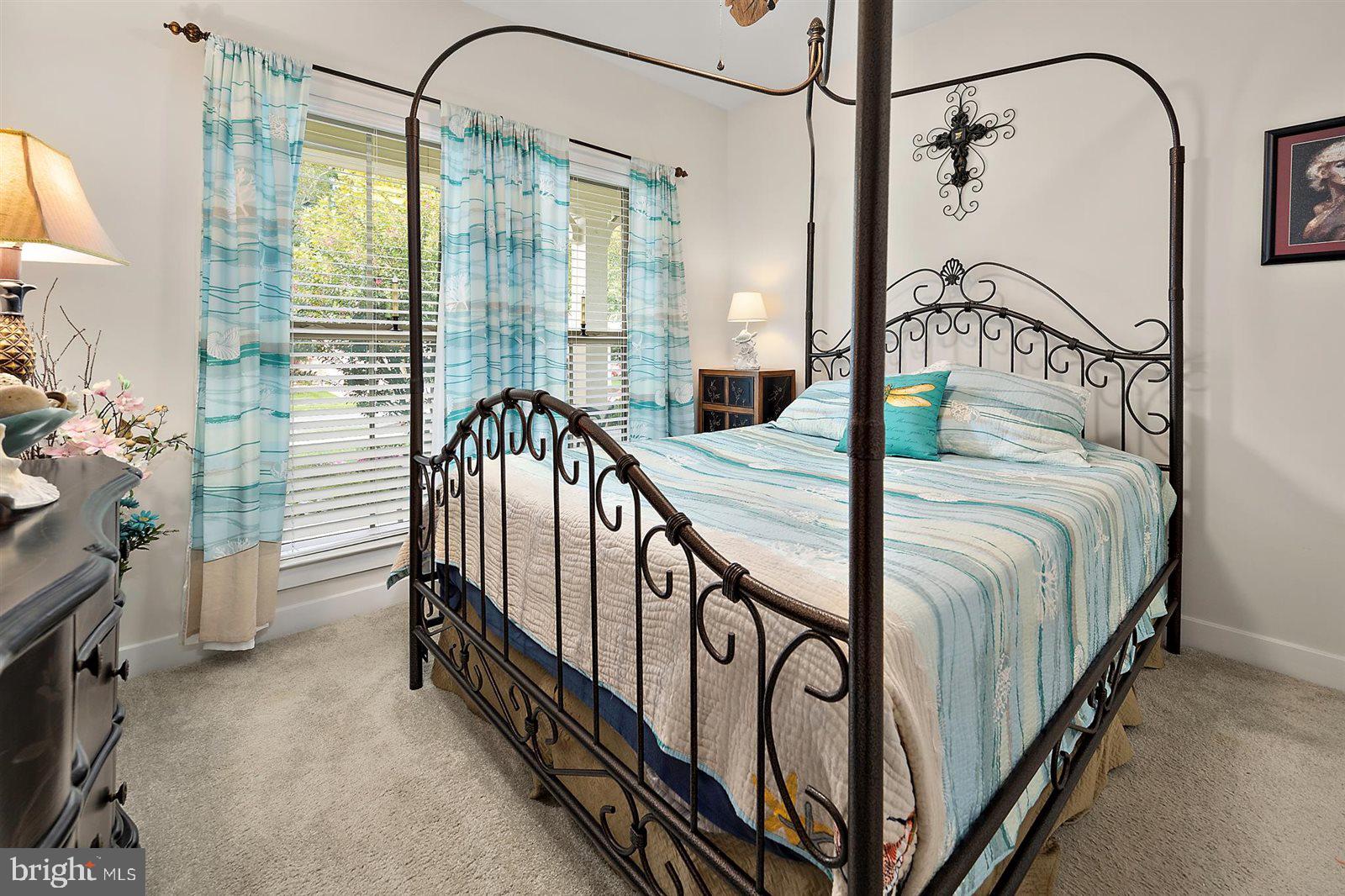 23546 Robalo Road Frankford, DE 19945 - Photo 43 of 78 a bedroom with a bed and a mirror