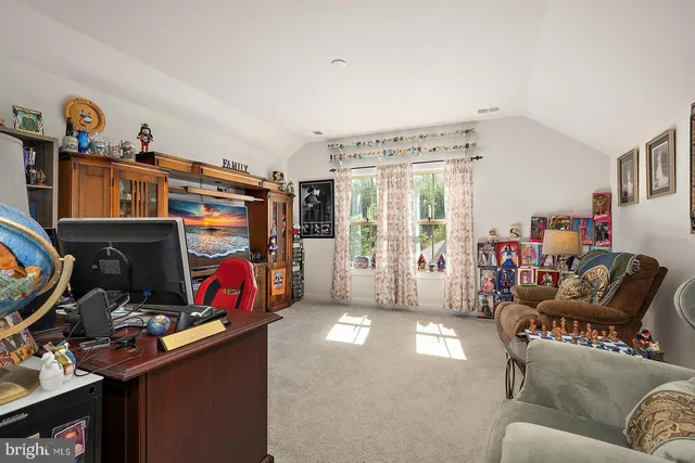 an aerial view of a house with a garden