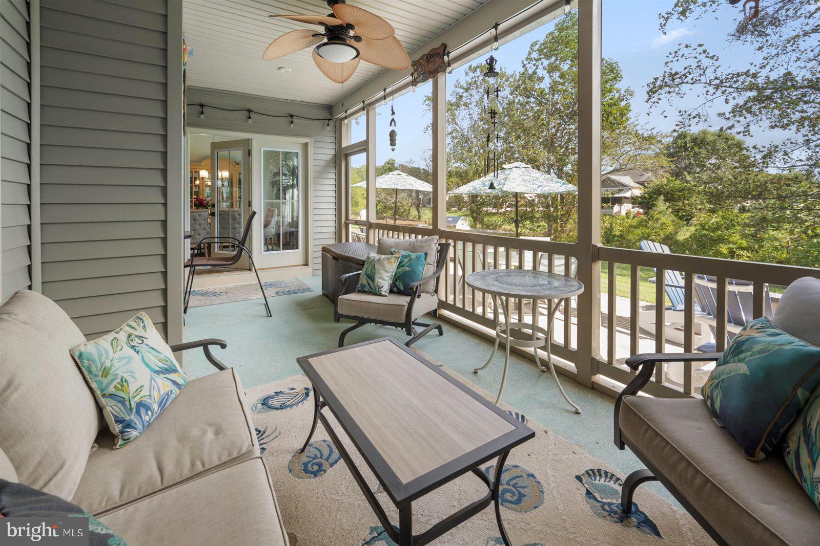23546 Robalo Road Frankford, DE 19945 - Photo 58 of 78 a balcony with furniture and a potted plant