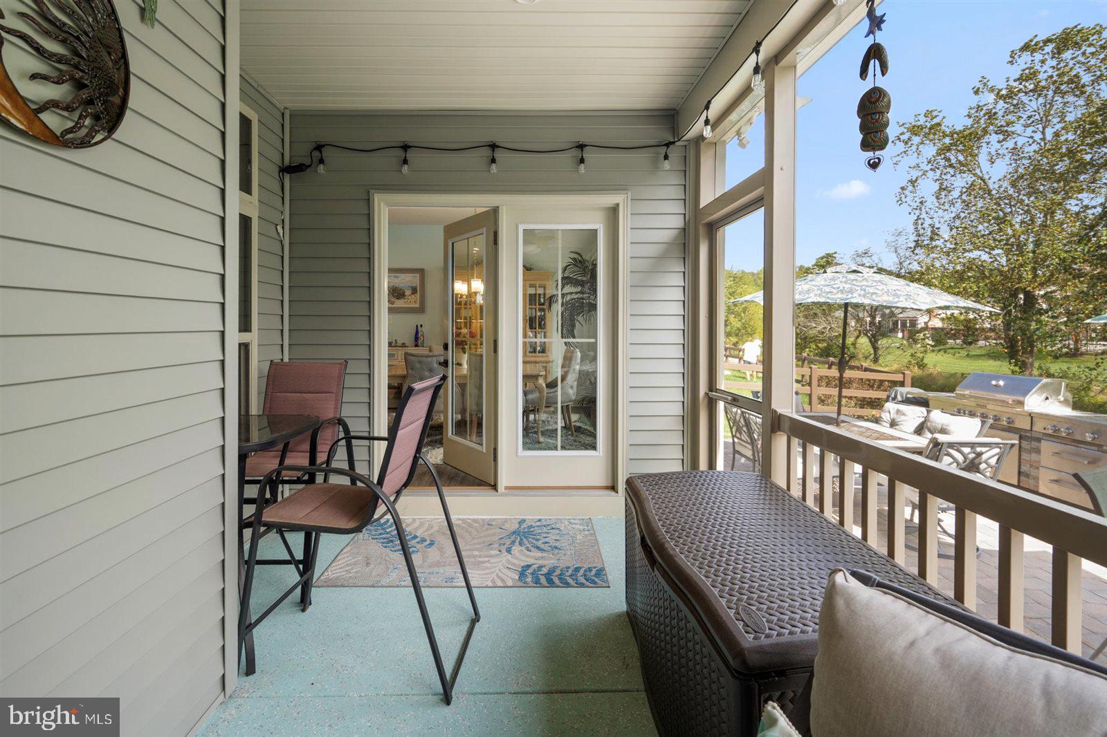 23546 Robalo Road Frankford, DE 19945 - Photo 59 of 78 a view of a patio with a table and chairs