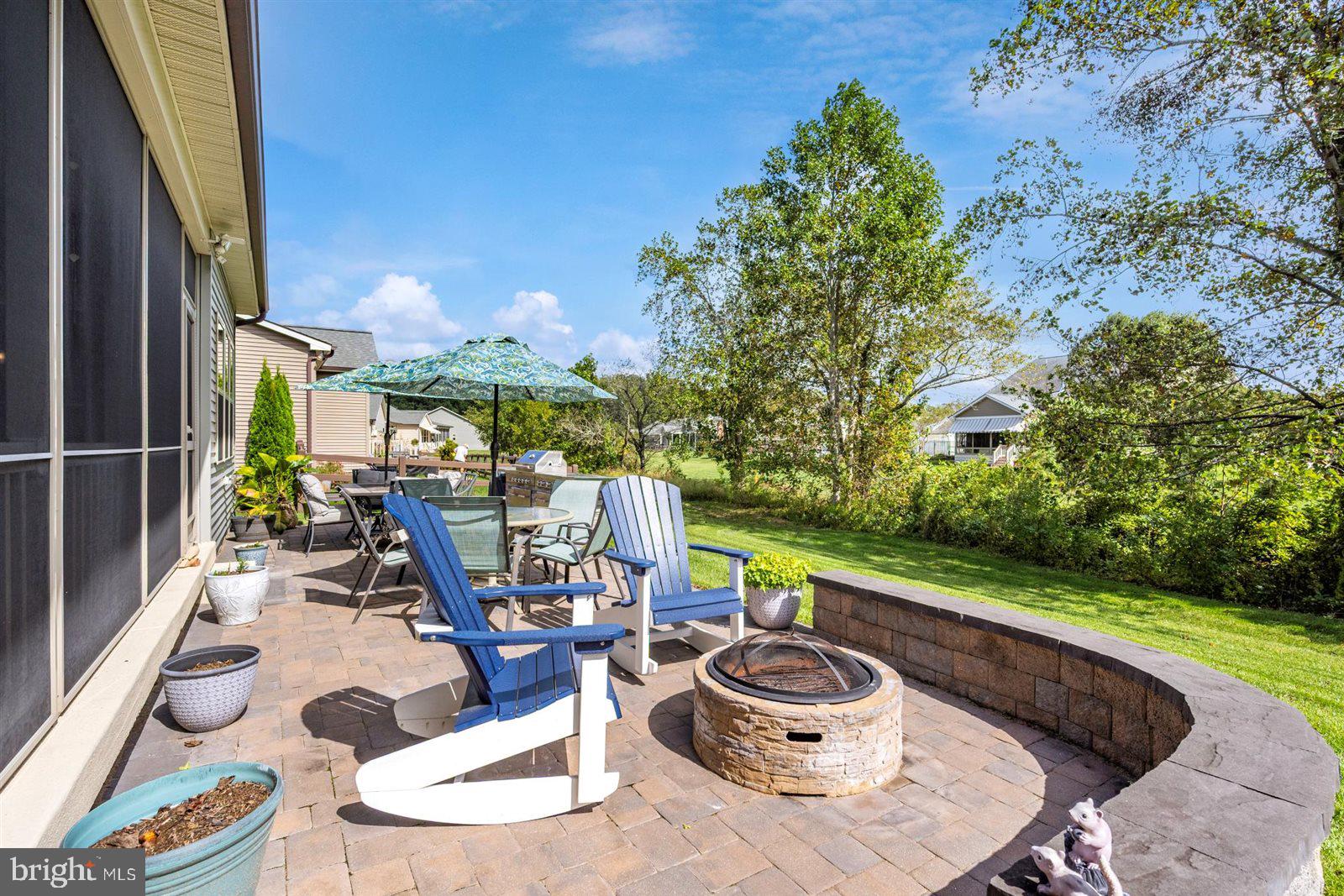 23546 Robalo Road Frankford, DE 19945 - Photo 62 of 78 a dining room with furniture and a floor to ceiling window