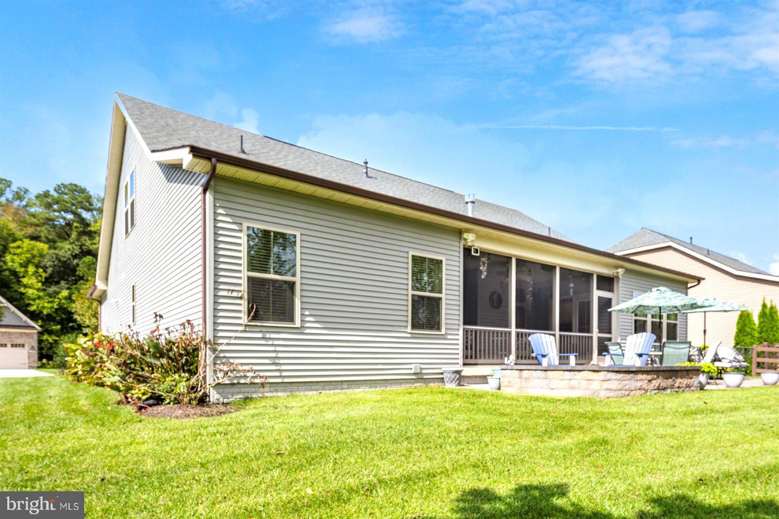 23546 Robalo Road Frankford, DE 19945 - Photo 65 of 78 a view of a house with swimming pool and porch