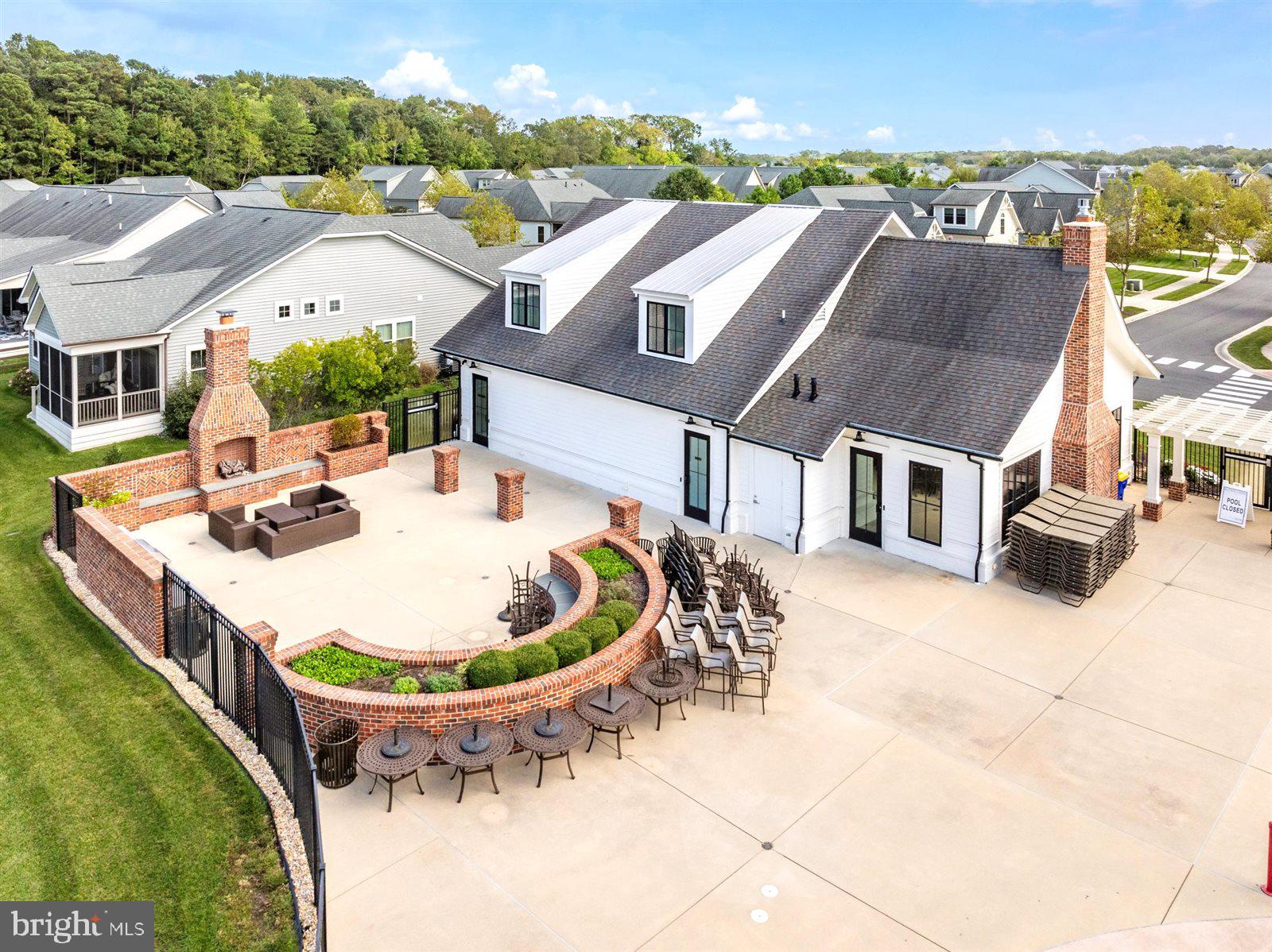 23546 Robalo Road Frankford, DE 19945 - Photo 71 of 78 an aerial view of a house with swimming pool and mountains