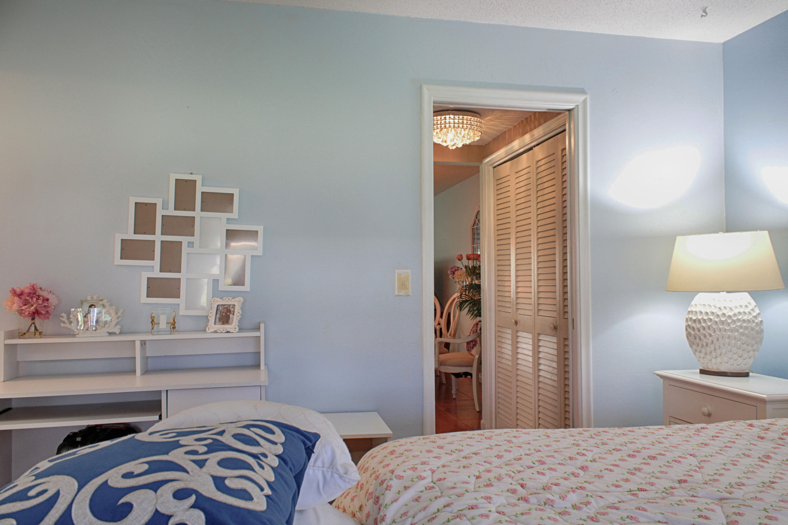 880 Horizon West, Unit 102 Boynton Beach, FL 33435 - Photo 21 of 34 a bedroom with a bed and a window