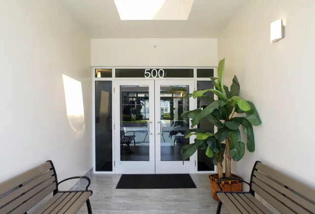 a view of a entryway with wooden floor