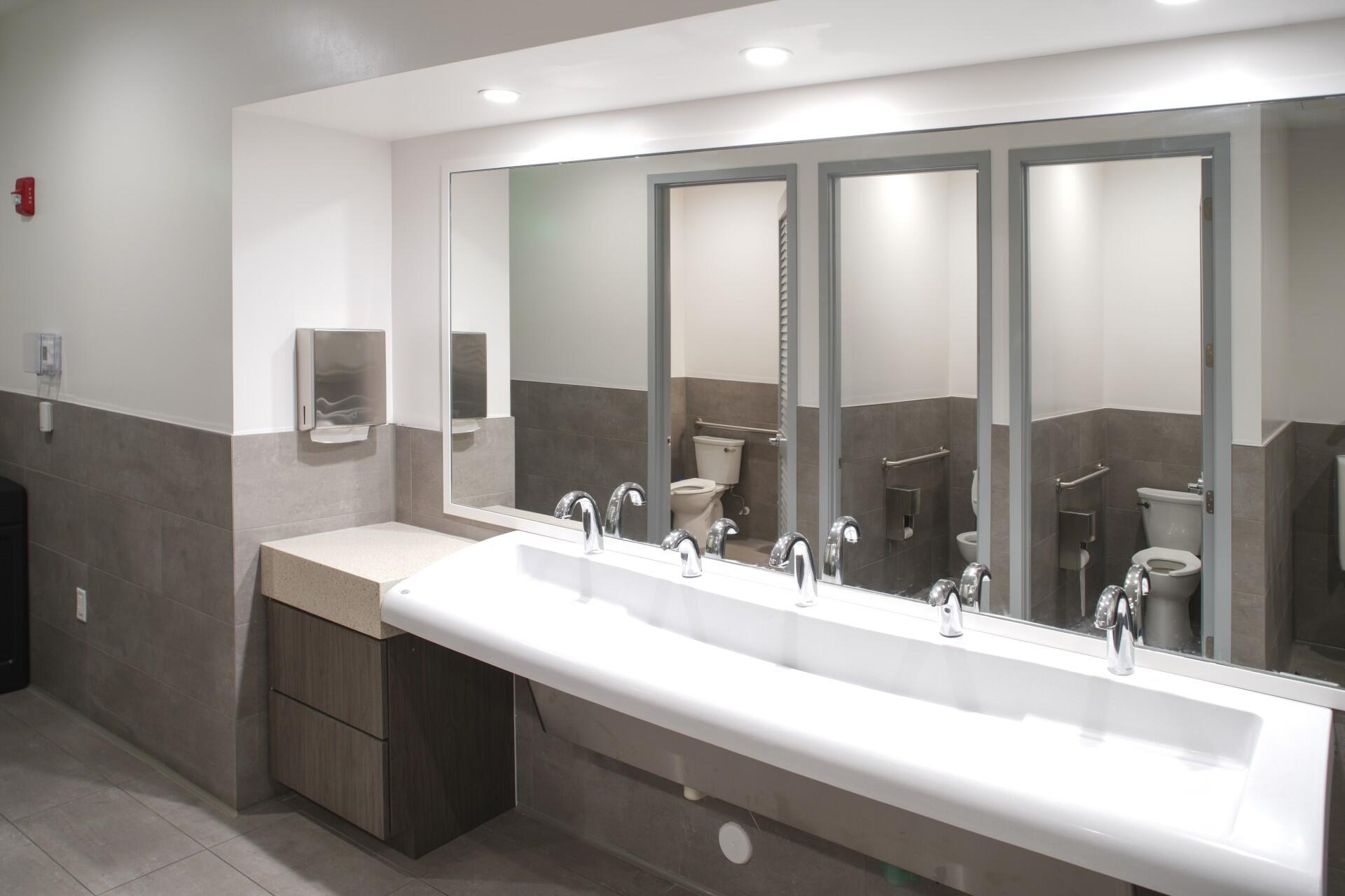 880 Horizon West, Unit 102 Boynton Beach, FL 33435 - Photo 33 of 34 a bathroom with a sink and a mirror