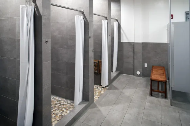 a bathroom with a shower and a sink