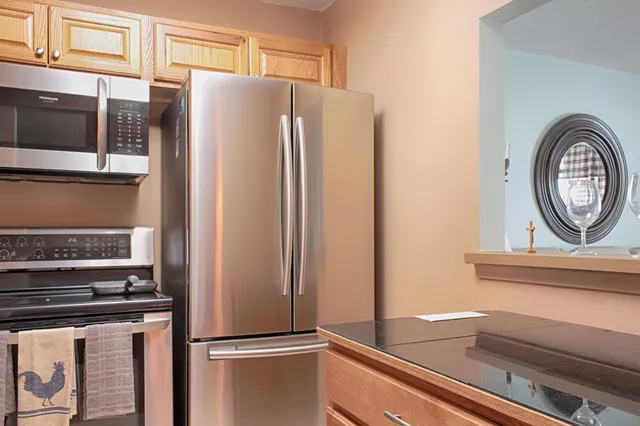 a close view of a refrigerator and a stove