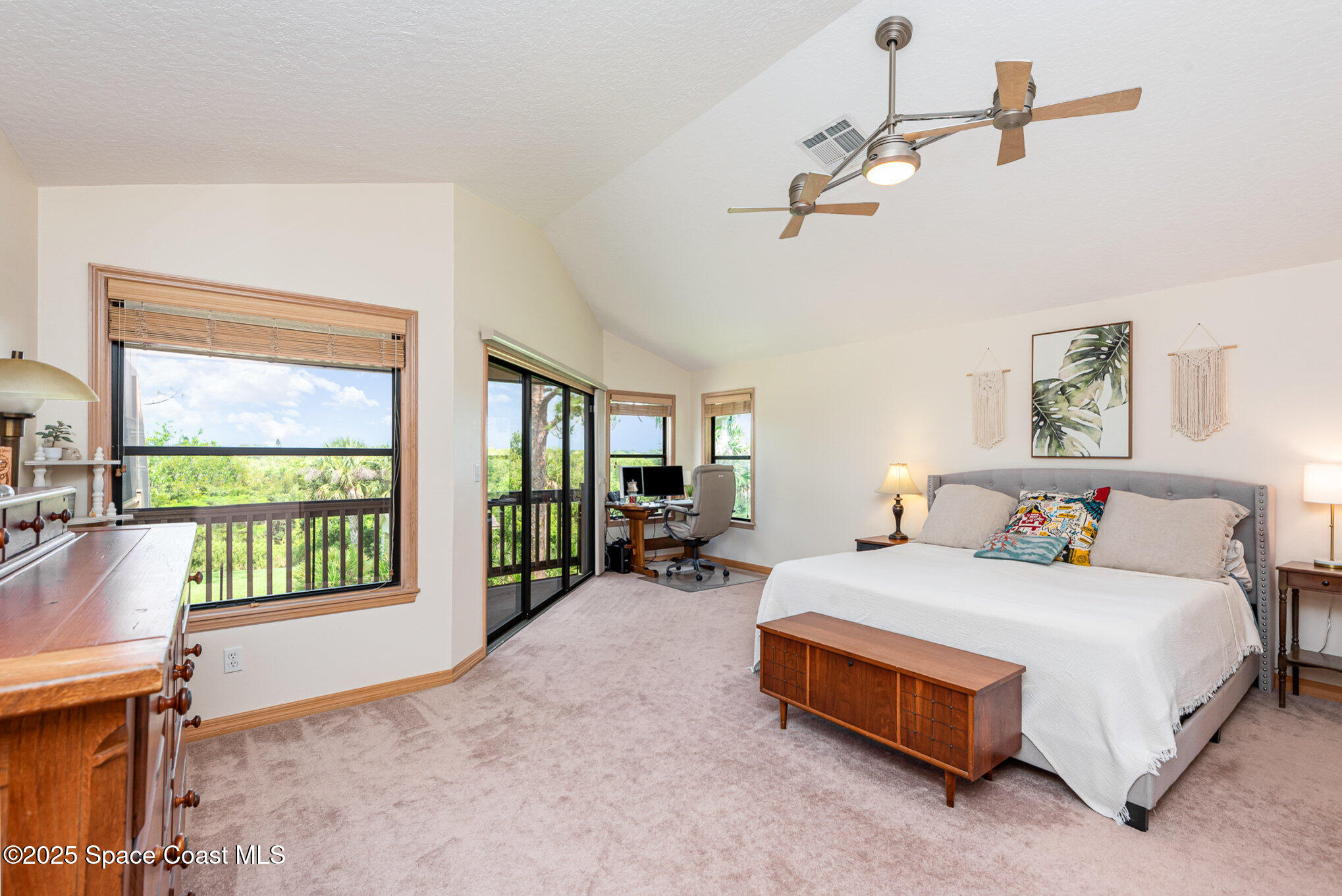 3750 Shady Run Road Melbourne, FL 32934 - Photo 18 of 50 a bedroom with a bed and a large window