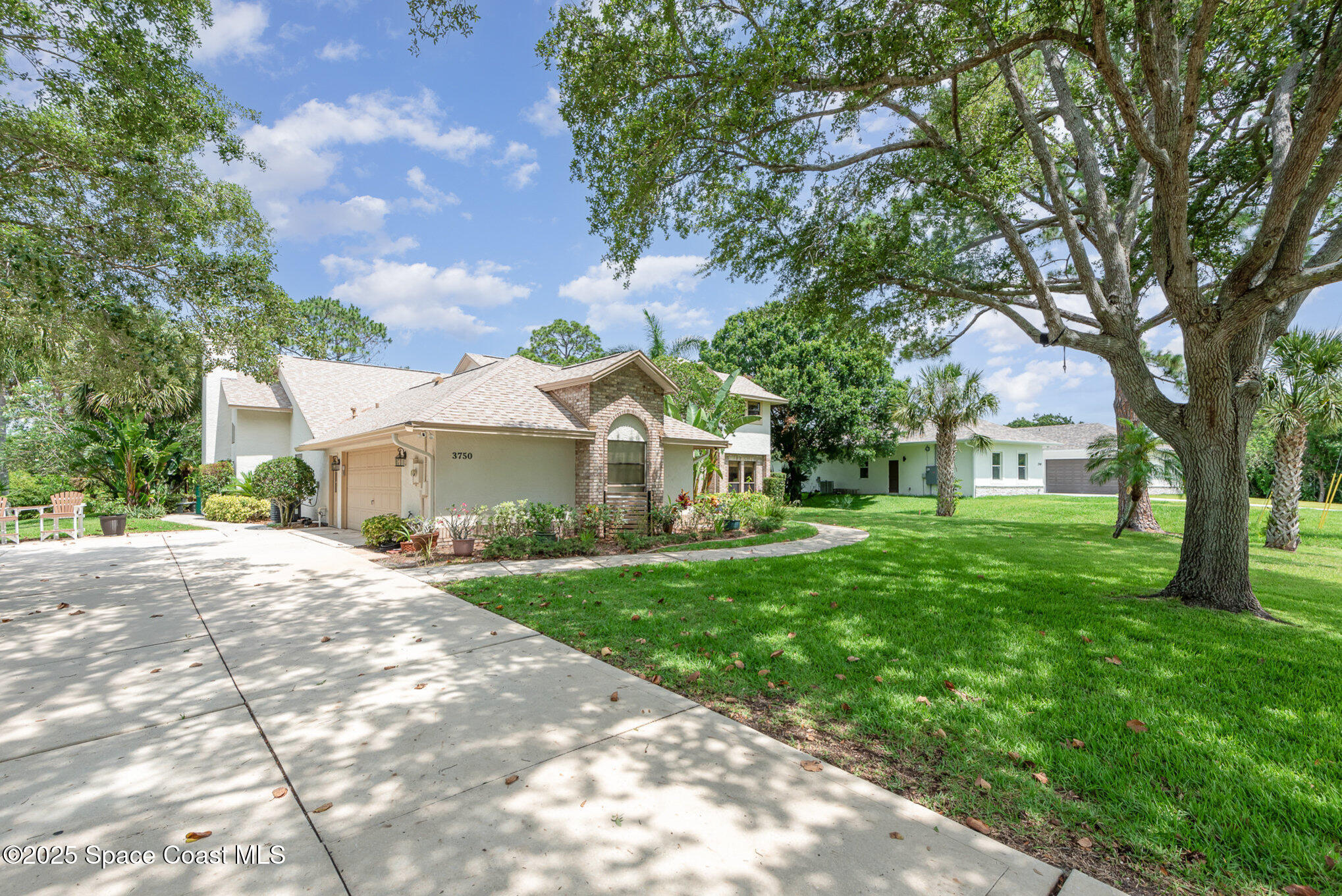 3750 Shady Run Road Melbourne, FL 32934 - Photo 2 of 50 a front view of a house with yard