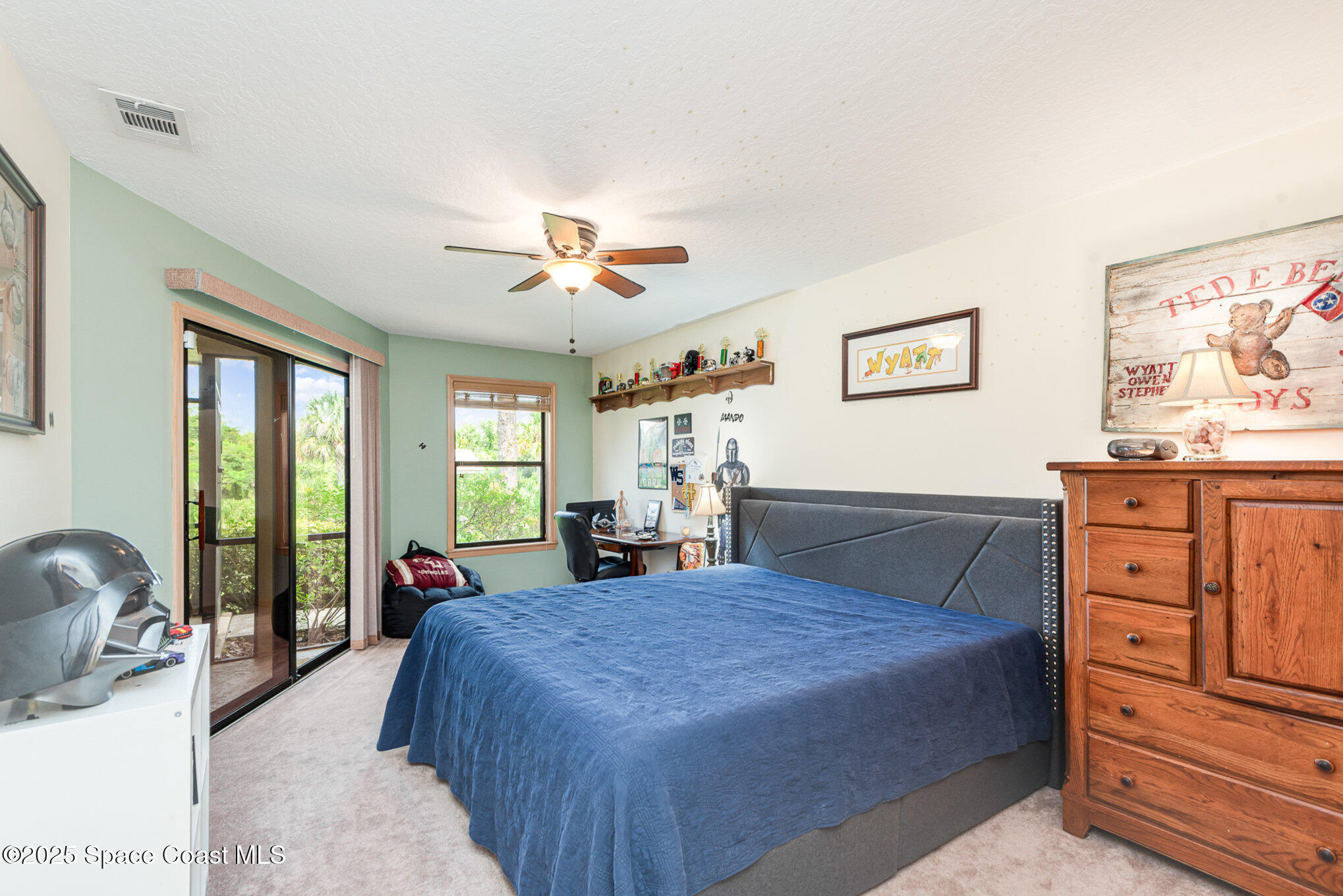 3750 Shady Run Road Melbourne, FL 32934 - Photo 23 of 50 a spacious bedroom with a bed and wooden floor