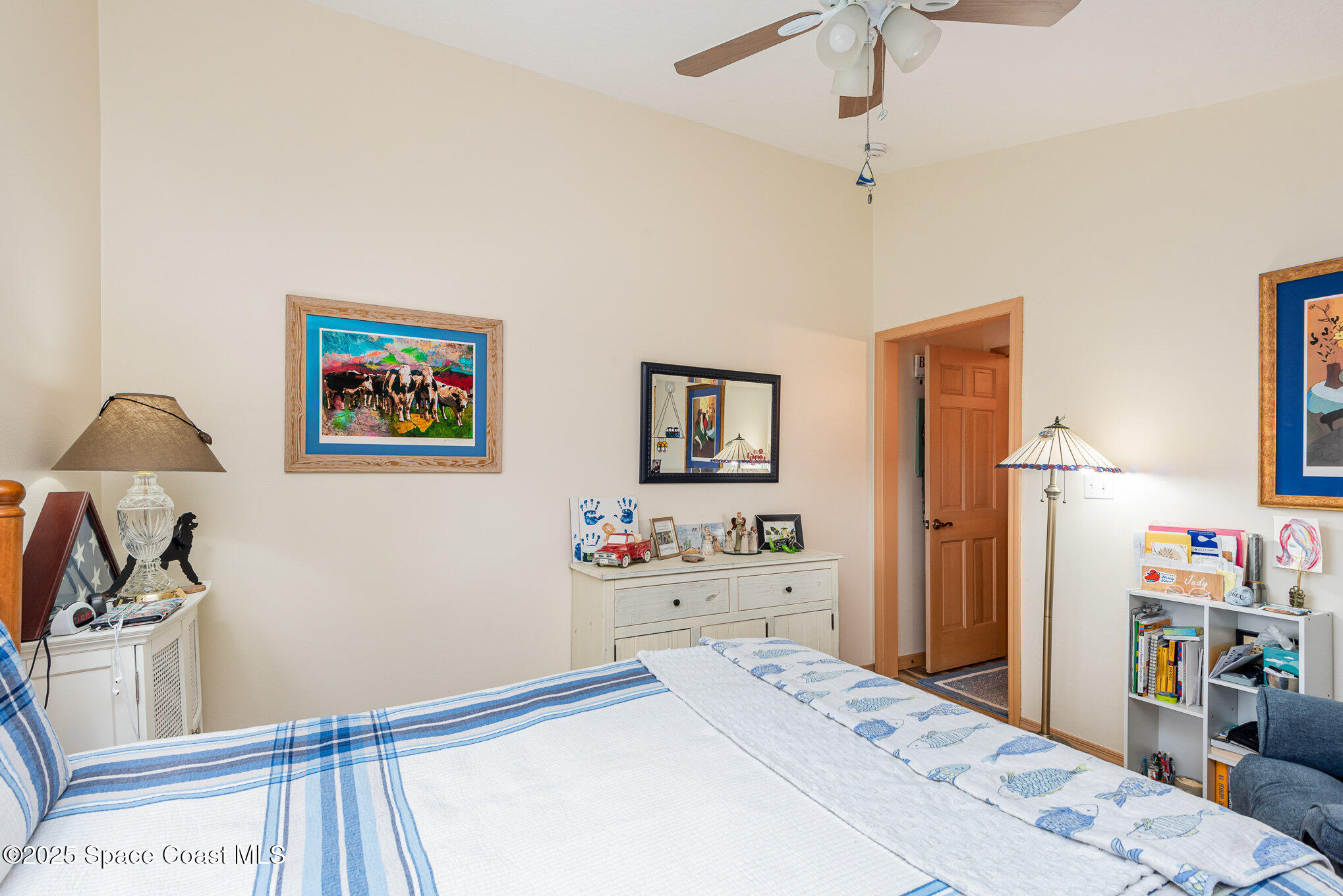 3750 Shady Run Road Melbourne, FL 32934 - Photo 25 of 50 a bedroom with a bed and a wooden floor