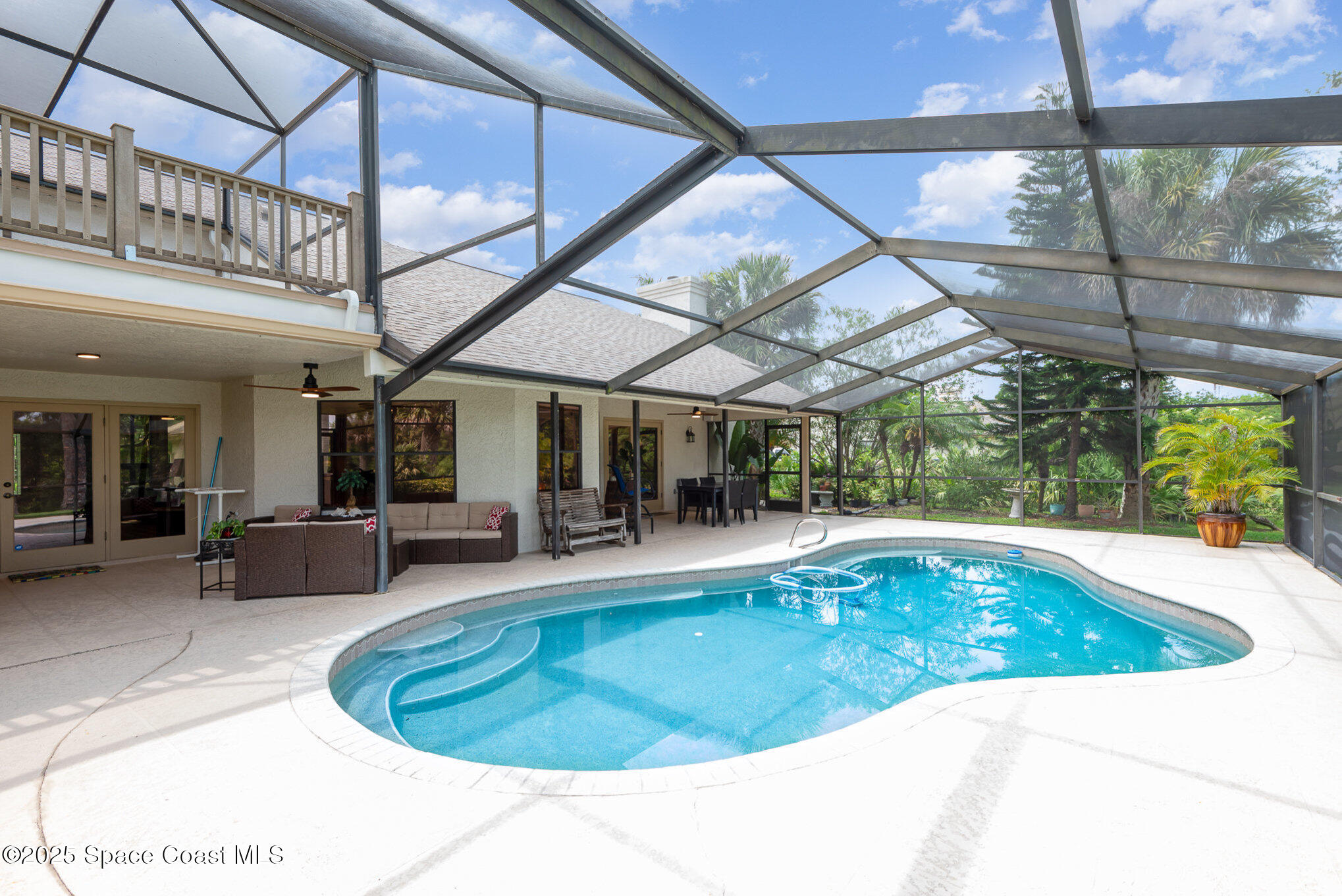 3750 Shady Run Road Melbourne, FL 32934 - Photo 3 of 50 a view of a swimming pool with a patio