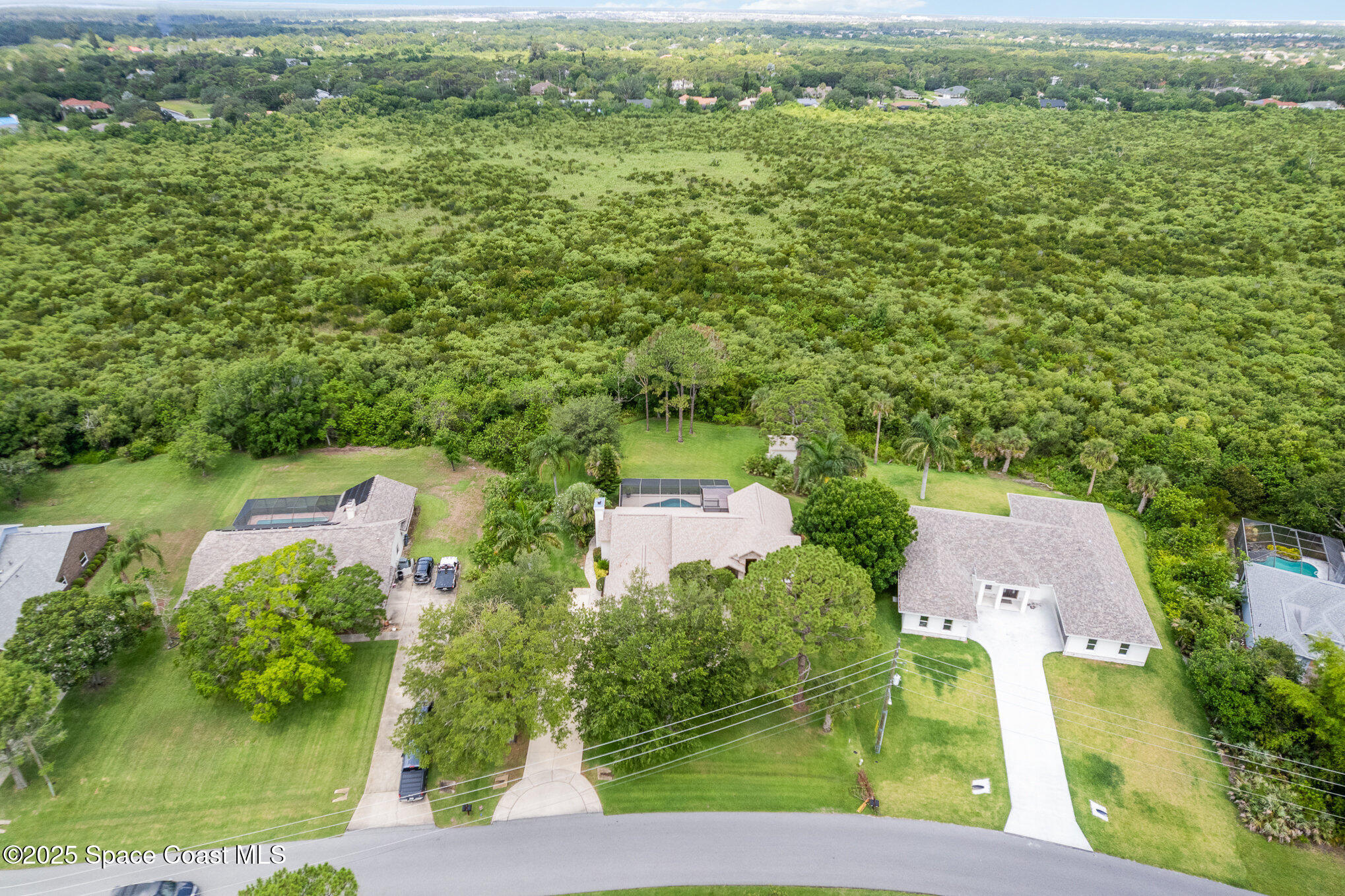 3750 Shady Run Road Melbourne, FL 32934 - Photo 33 of 50 an aerial view of residential houses with outdoor space and trees