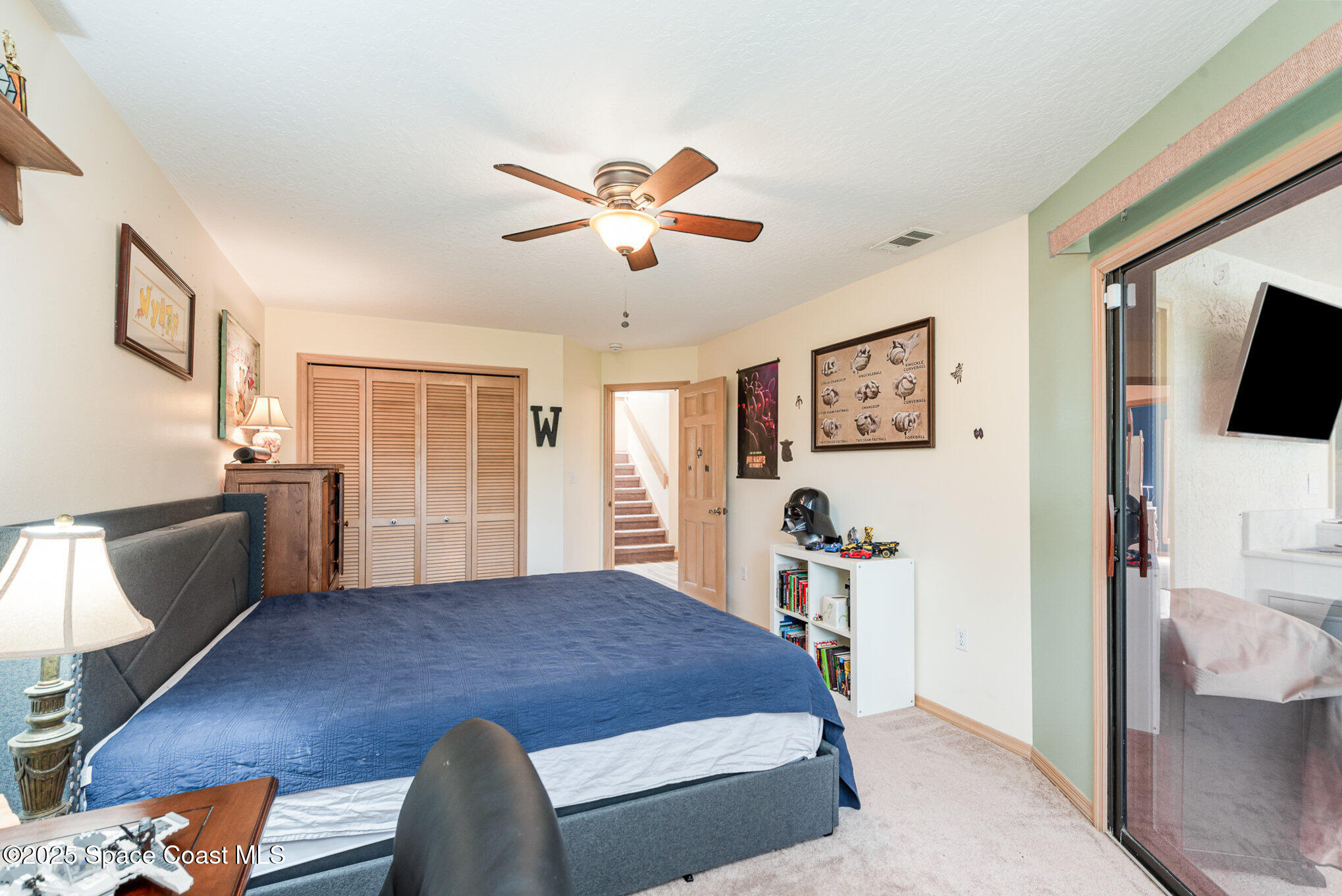 3750 Shady Run Road Melbourne, FL 32934 - Photo 35 of 50 a bedroom with a bed and wooden floor