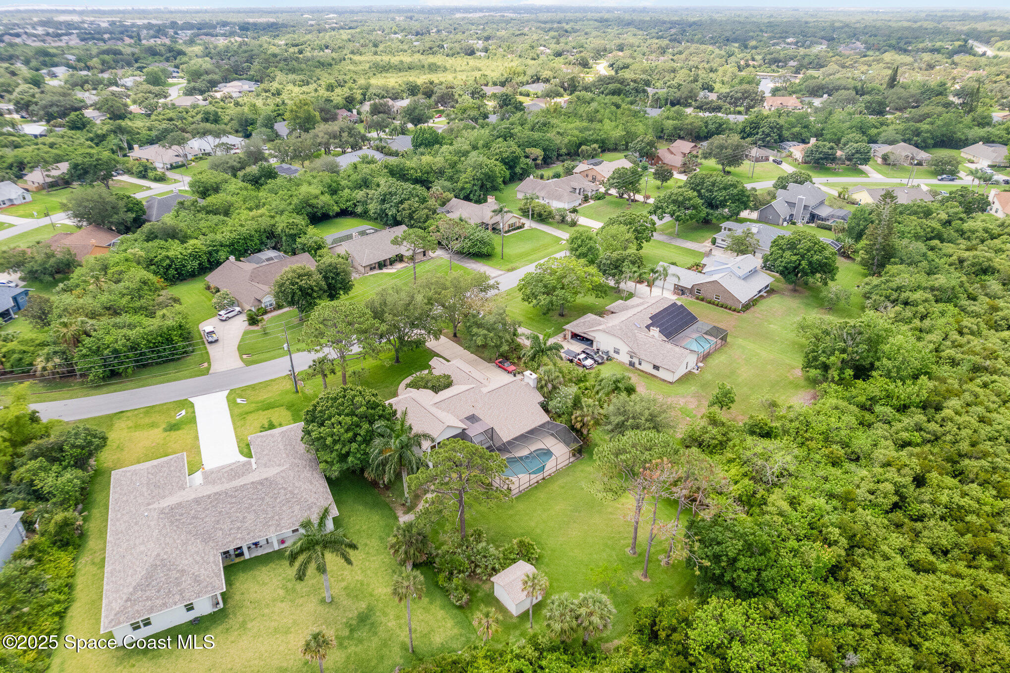 3750 Shady Run Road Melbourne, FL 32934 - Photo 42 of 50 an aerial view of residential houses with outdoor space and trees