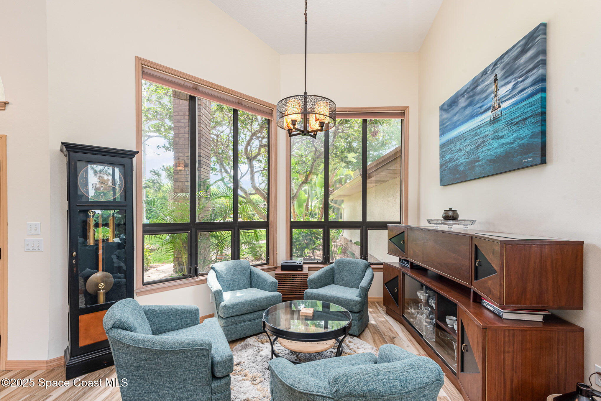 3750 Shady Run Road Melbourne, FL 32934 - Photo 5 of 50 a living room with furniture and a floor to ceiling window