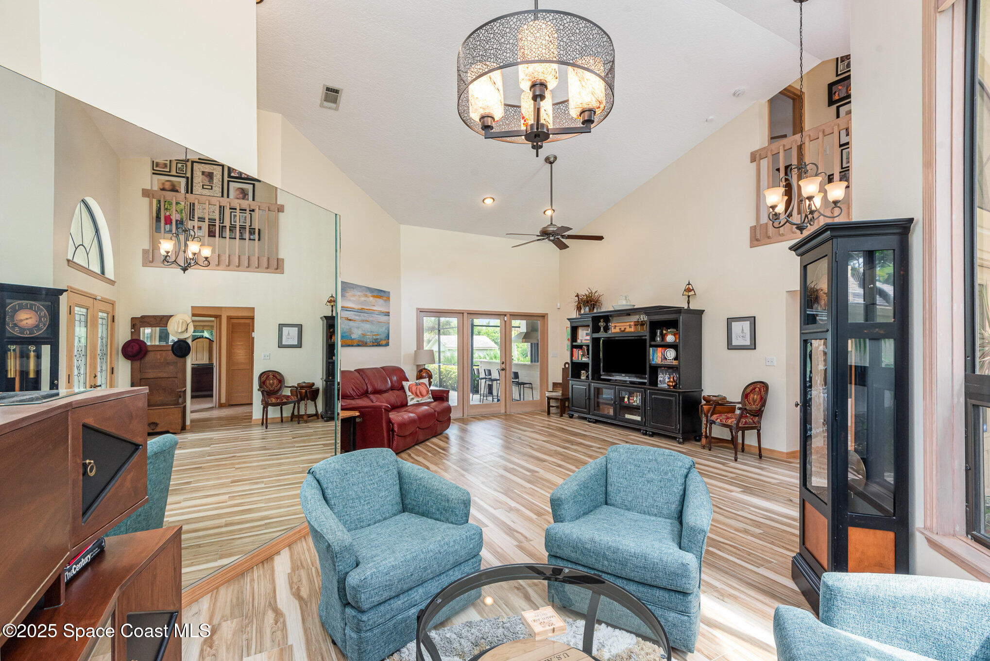 3750 Shady Run Road Melbourne, FL 32934 - Photo 6 of 50 a living room with furniture kitchen view and a large window