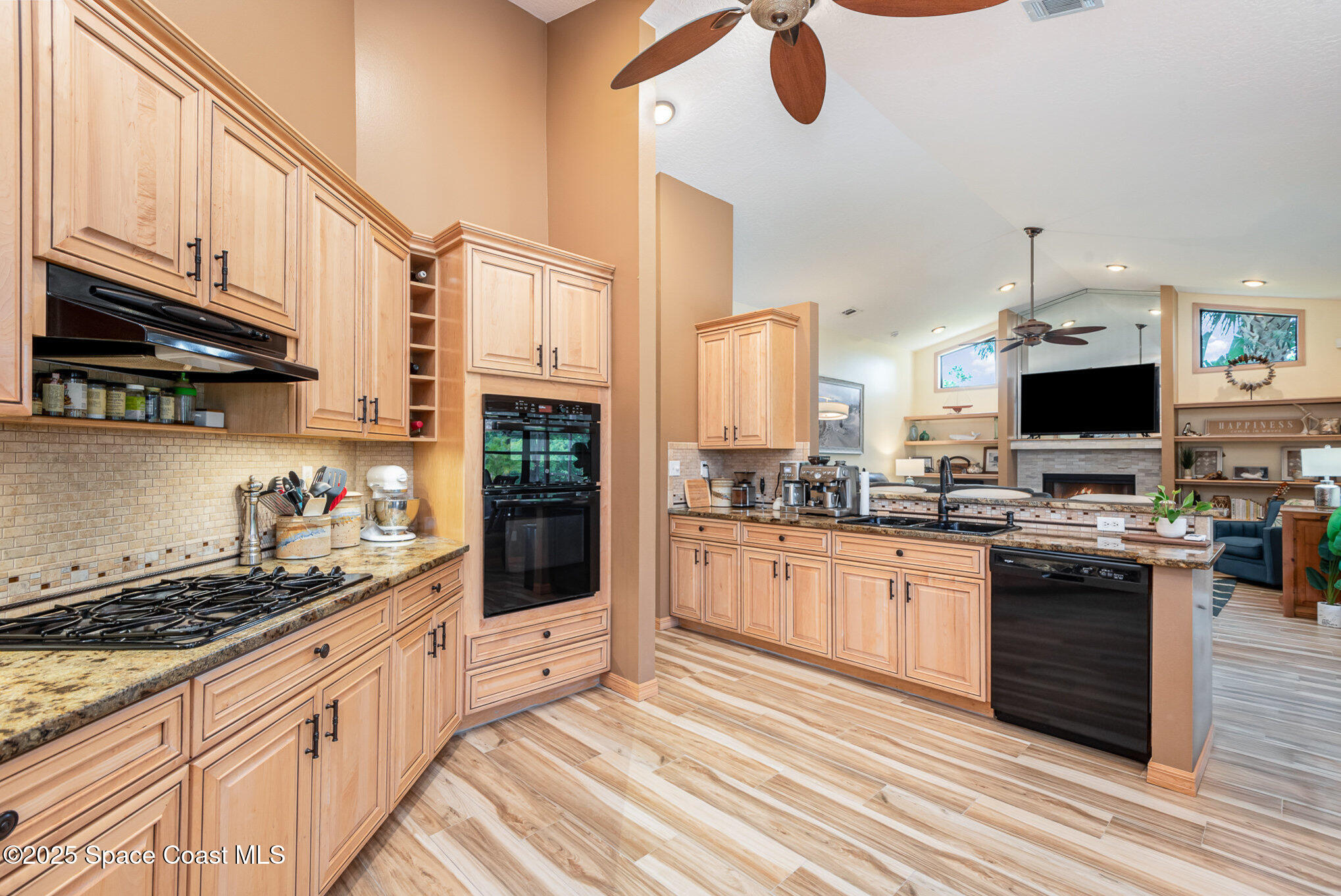 3750 Shady Run Road Melbourne, FL 32934 - Photo 8 of 50 a kitchen with stainless steel appliances kitchen island granite countertop a sink and cabinets