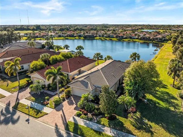 an aerial view of a house with a lake view