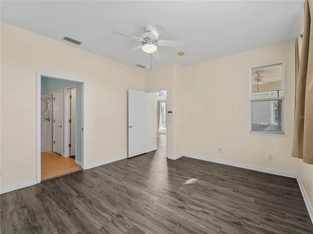 a bathroom with a shower sink and mirror