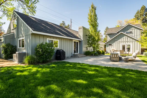 a view of a house with a yard porch and sitting area